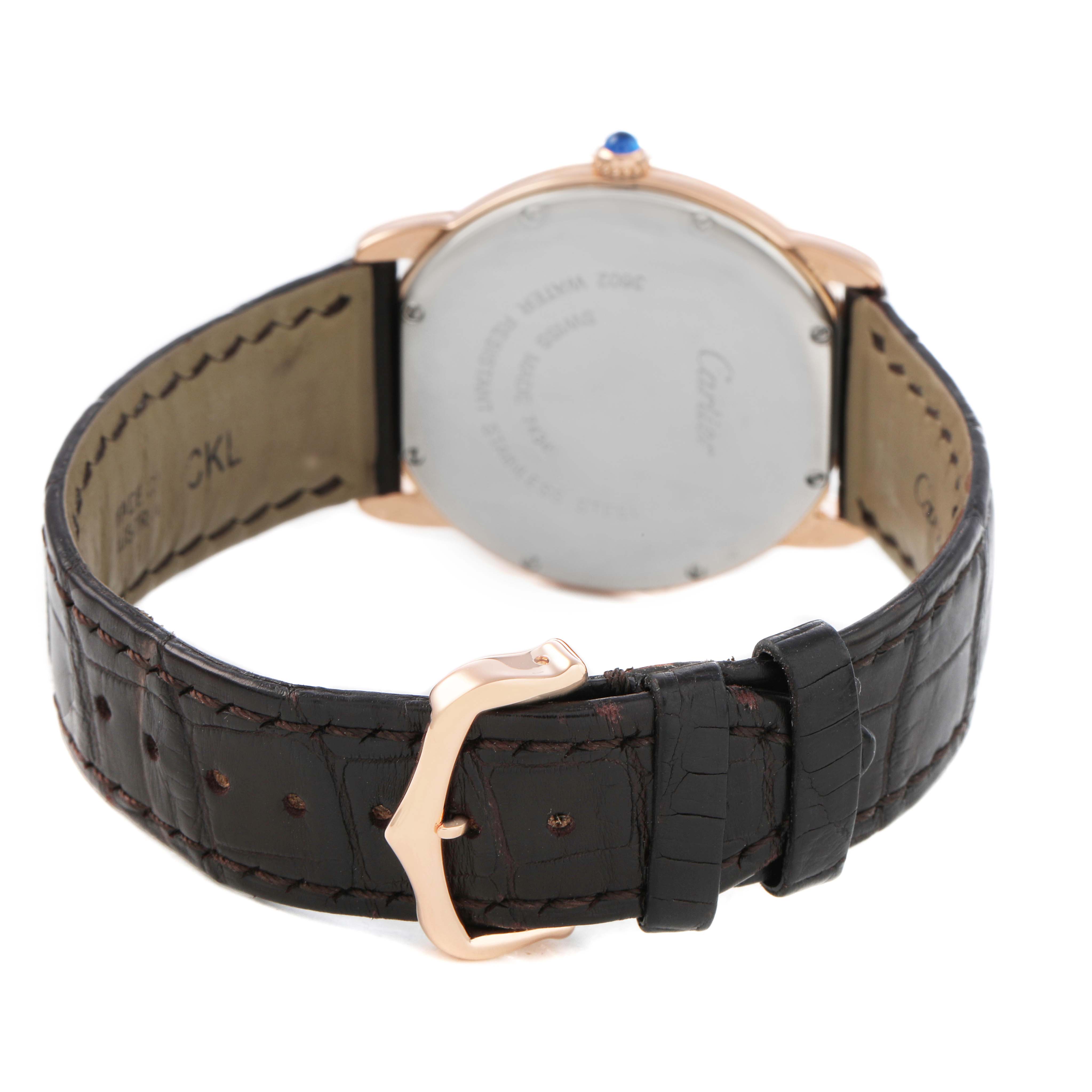 The Cartier Ronde W6701008 Men's Steel and Gold (two tone) Silver Dial watch is shown from the back, highlighting the strap, buckle, and case back.