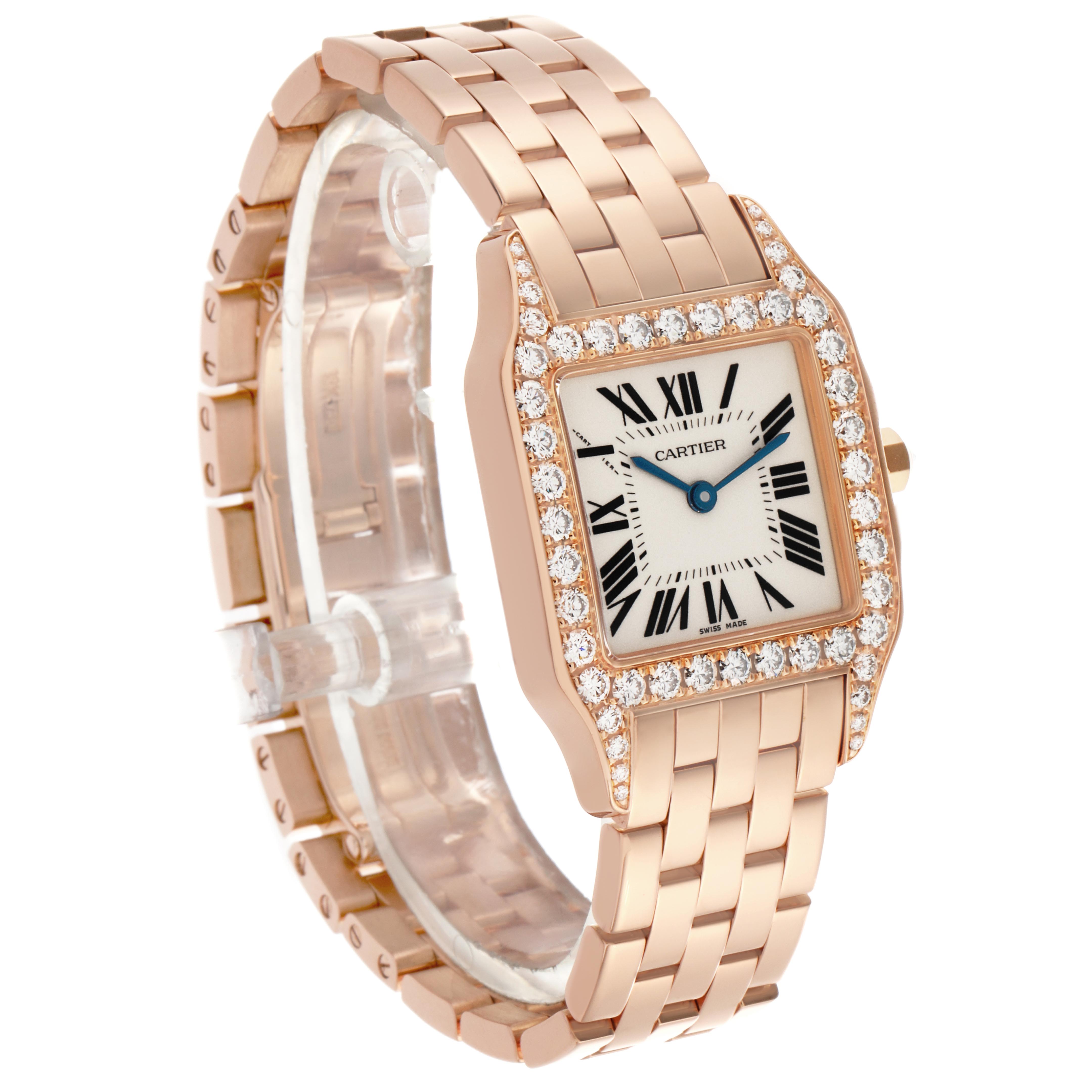 The Cartier Santos Demoiselle WF9007Z8 Women
s Rose Gold Silver Dial WF9007Z8 Women
s Rose Gold Silver Dial watch is shown at a three-quarter angle, highlighting the face, diamond bezel, and bracelet.
