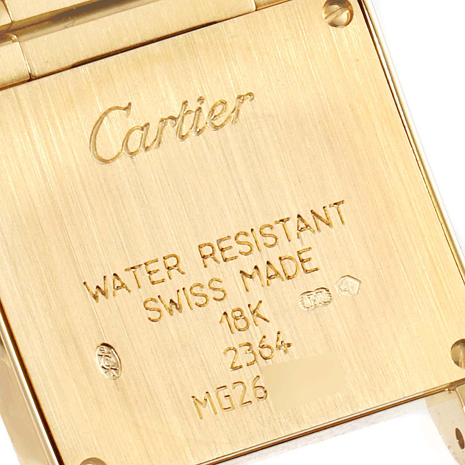 This image shows the engraved back case of a Cartier Tank Francaise WE1001R8 Women
s Yellow Gold Silver Dial WE1001R8 Women
s Yellow Gold Silver Dial watch, highlighting details such as its water resistance and material.