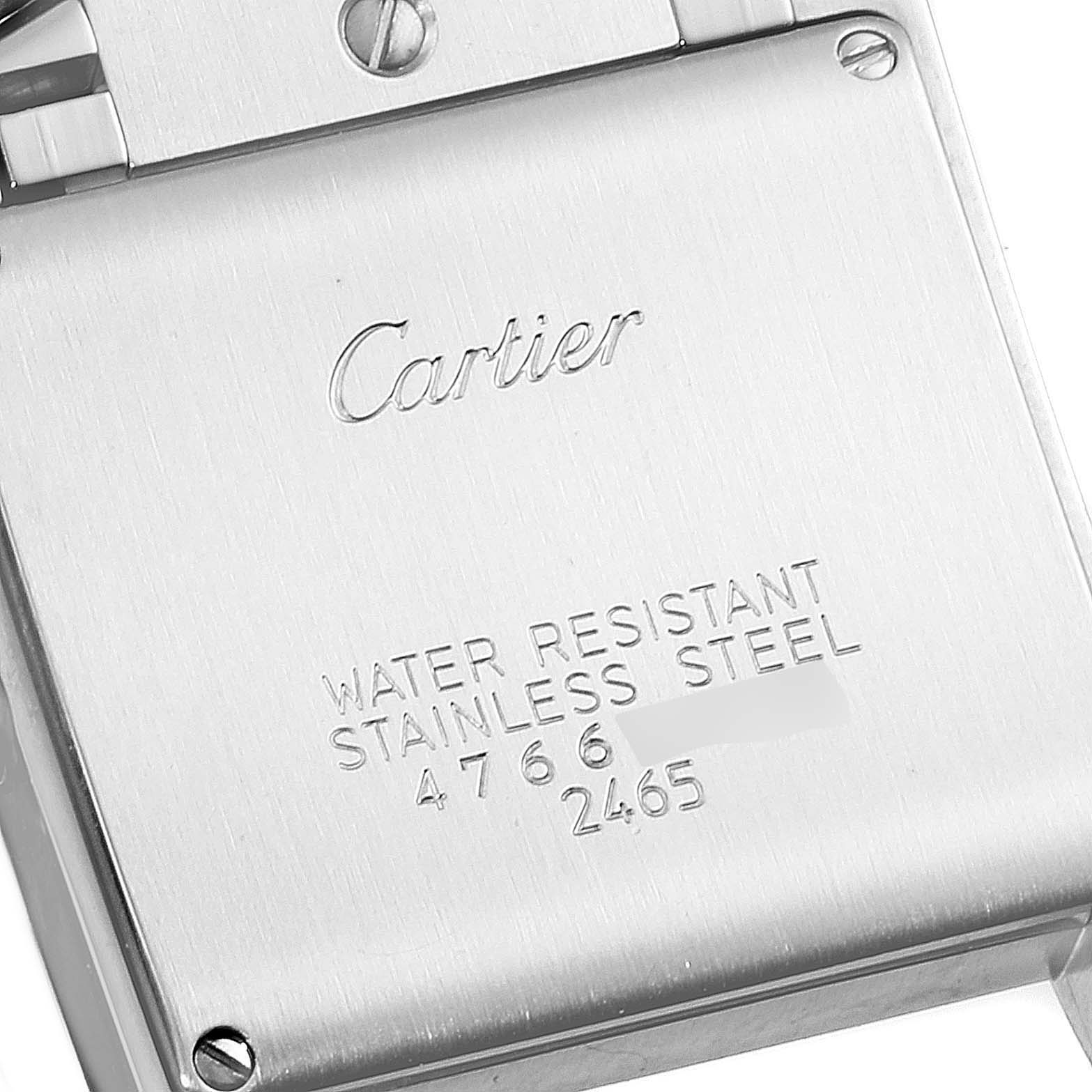 The image shows the back case of a Cartier Tank Francaise W51011Q3 Women
s Stainless Steel Silver Dial W51011Q3 Women
s Stainless Steel Silver Dial watch, highlighting the engraving and screws.
