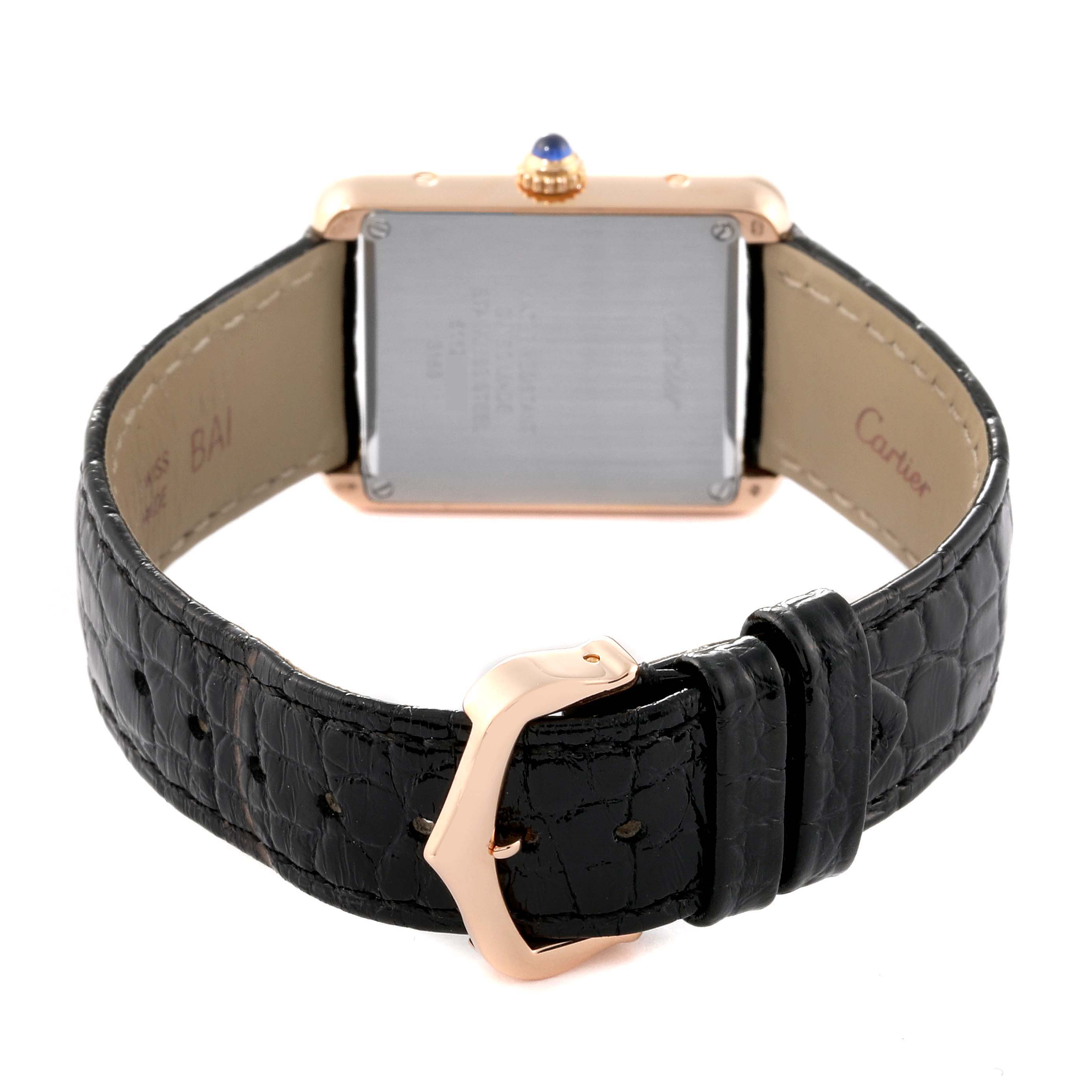 This image shows the back view of the Cartier Tank Solo W5200024 Women's Steel and Gold (two tone) Silver Dial W5200024 Women's Steel and Gold (two tone) Silver Dial watch, highlighting the case back and leather strap with a rose gold buckle.