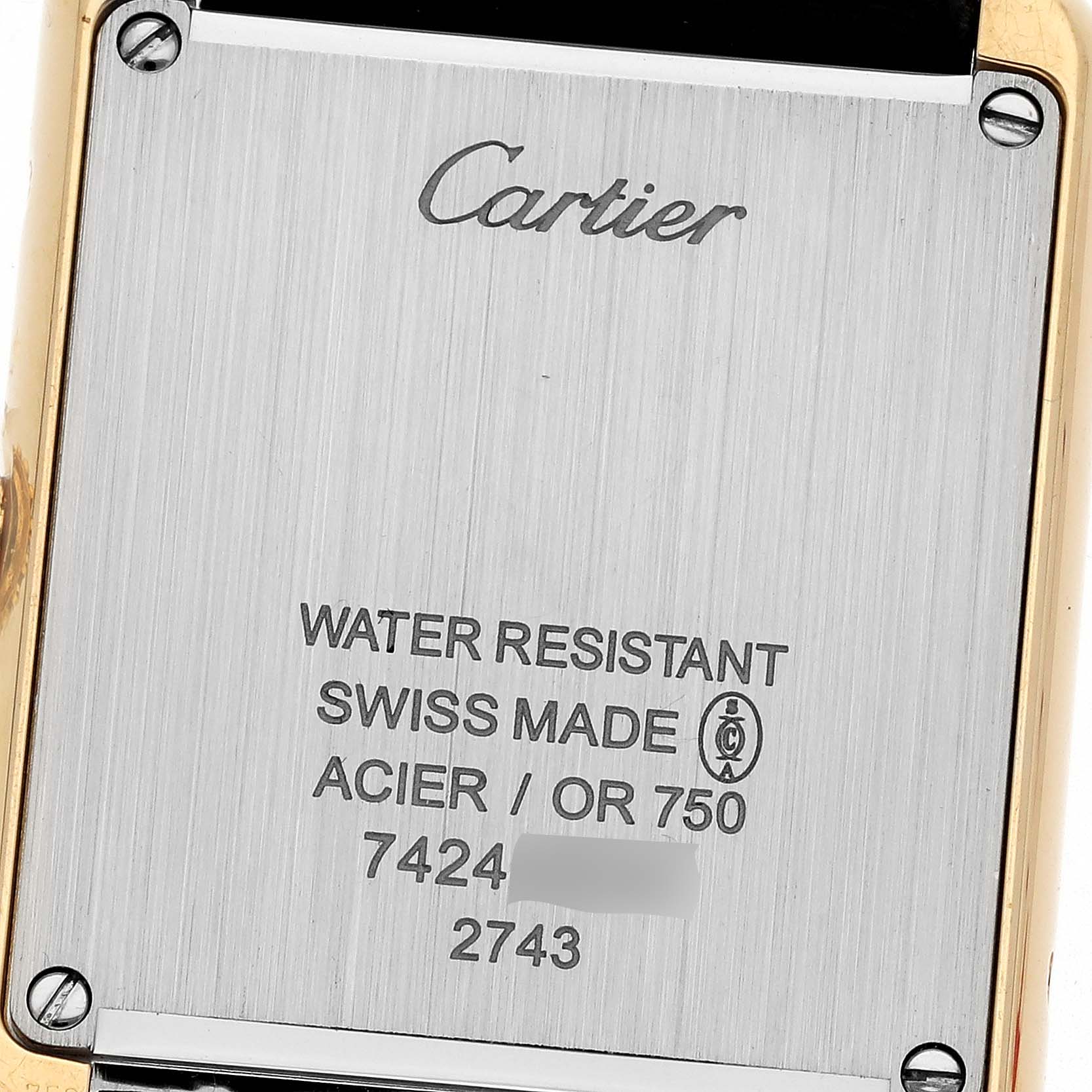 This image shows the engraved backside of a Tank Solo watch by Cartier at a close-up angle.