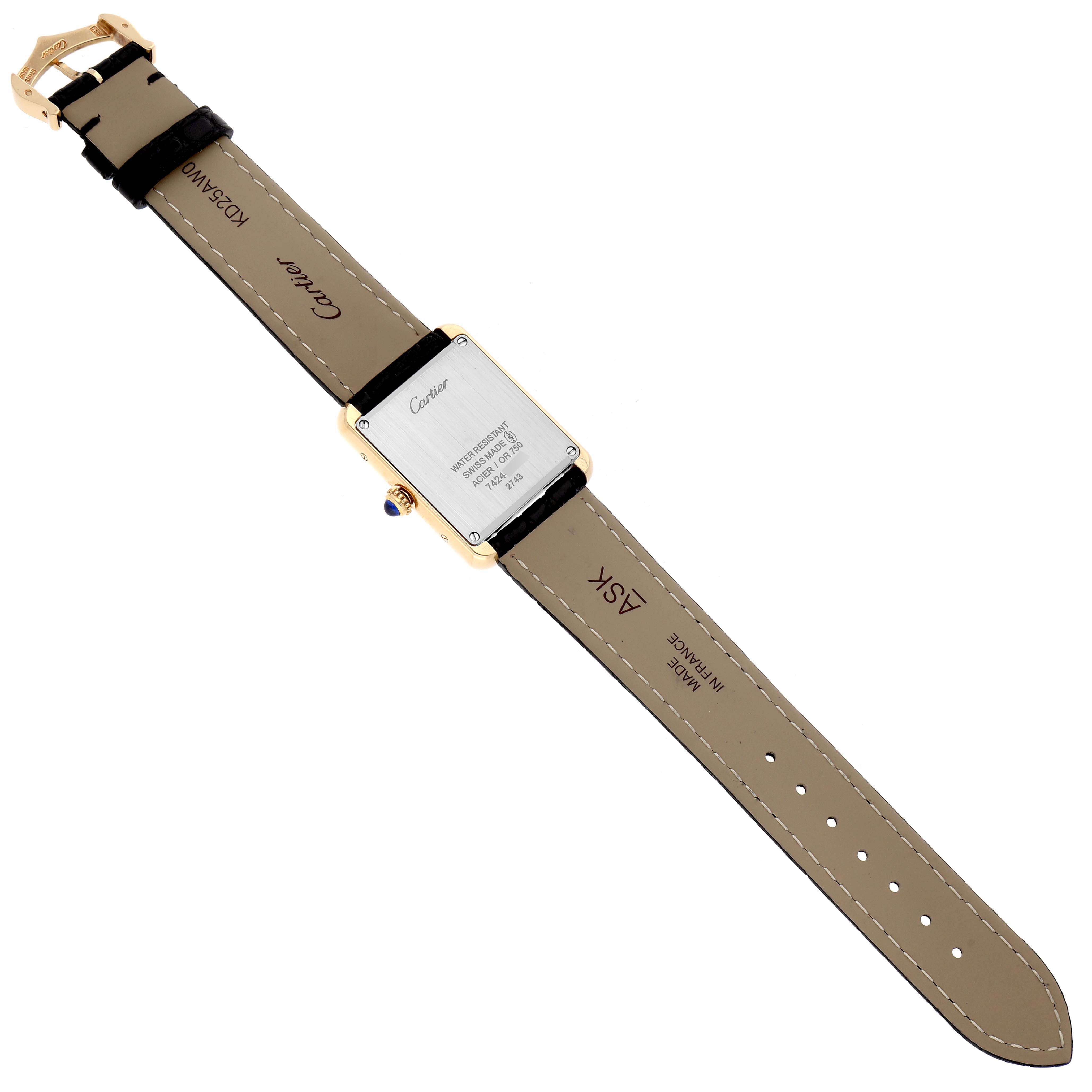 This image shows the Cartier Tank Solo W1018755 Women's Steel and Gold (two tone) Silver Dial W1018755 Women's Steel and Gold (two tone) Silver Dial model watch from the back, revealing the leather strap and the case back details.