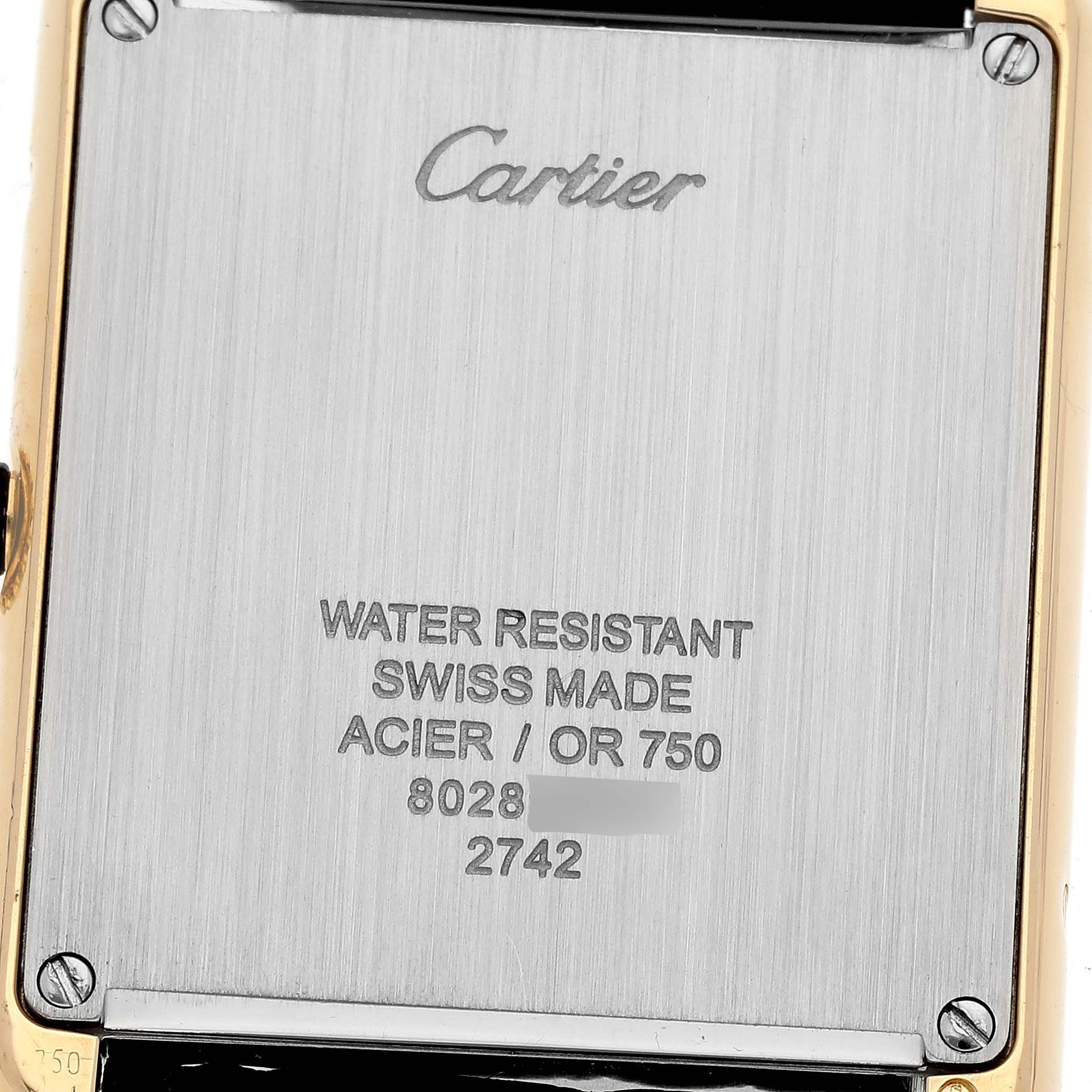 The image shows the back case of the Cartier Tank Solo W1018855 Men's Steel and Gold (two tone) Silver Dial W1018855 Men's Steel and Gold (two tone) Silver Dial watch, displaying various engravings and the brand's name.
