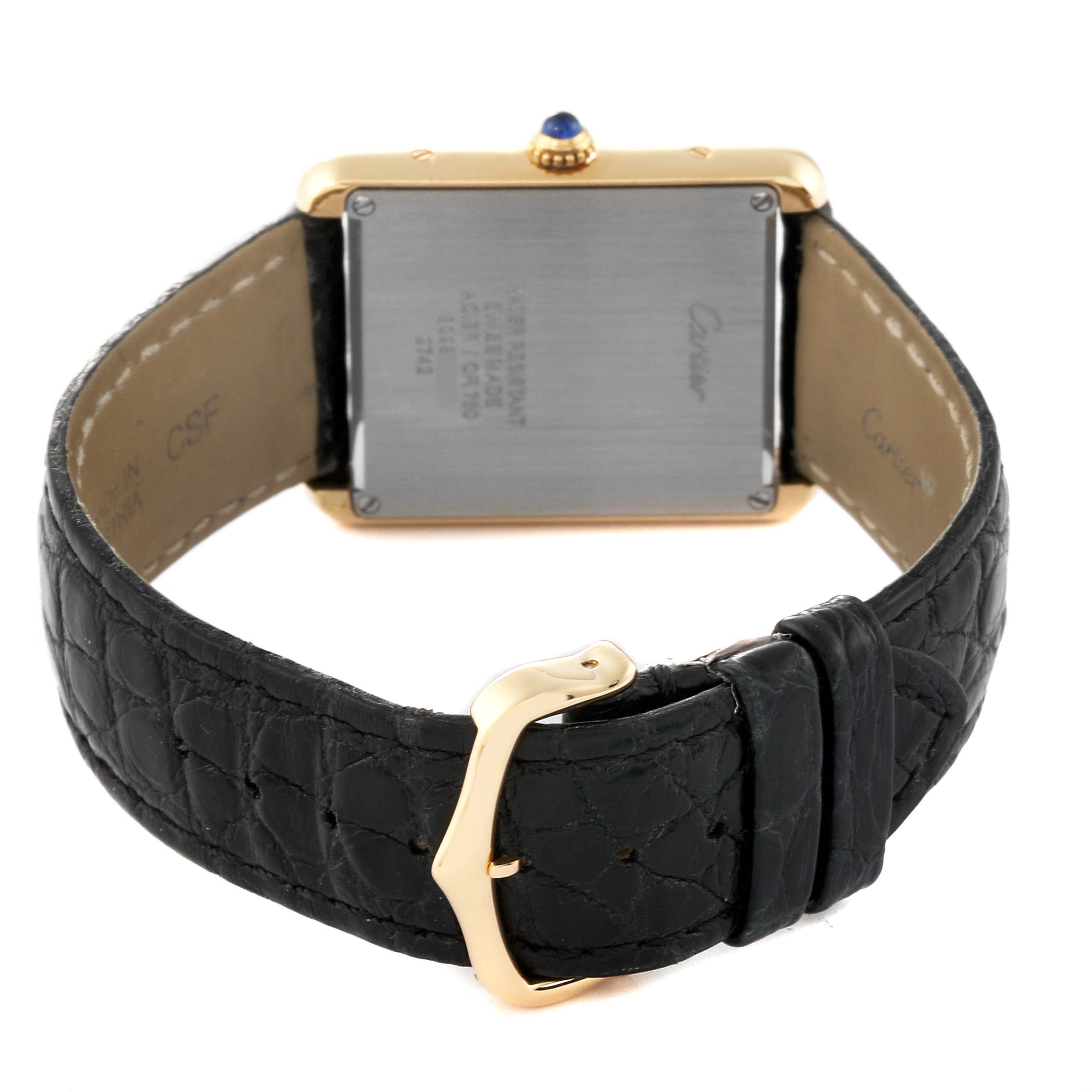 The image shows the back view of the Cartier Tank Solo W1018855 Men's Steel and Gold (two tone) Silver Dial W1018855 Men's Steel and Gold (two tone) Silver Dial watch, highlighting the case back, strap, and buckle.