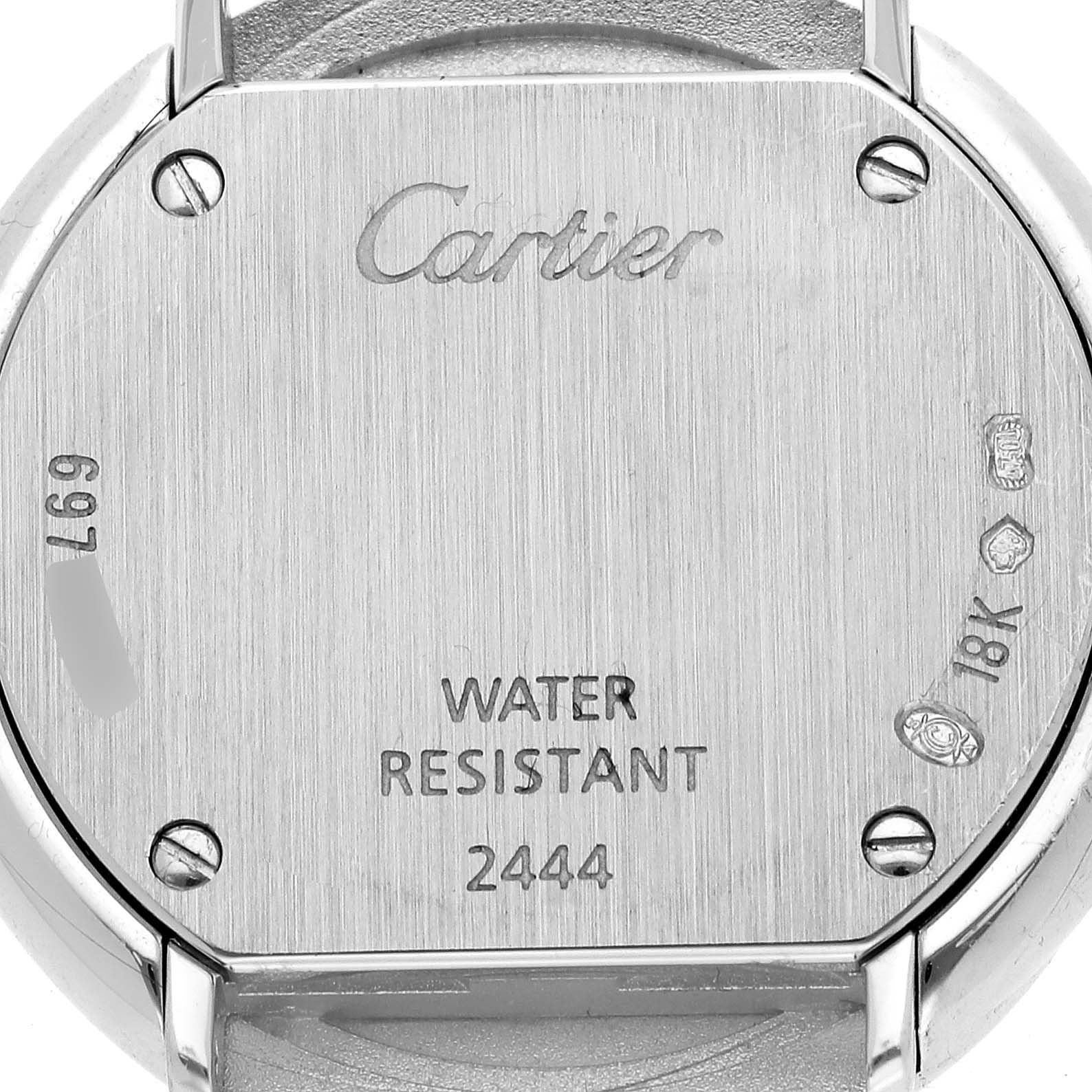 The image shows the back case of a Cartier Trinity WG201041 Women's White Gold Silver Dial WG201041 Women's White Gold Silver Dial watch, highlighting the brand name, water resistance, and 18K gold marking.