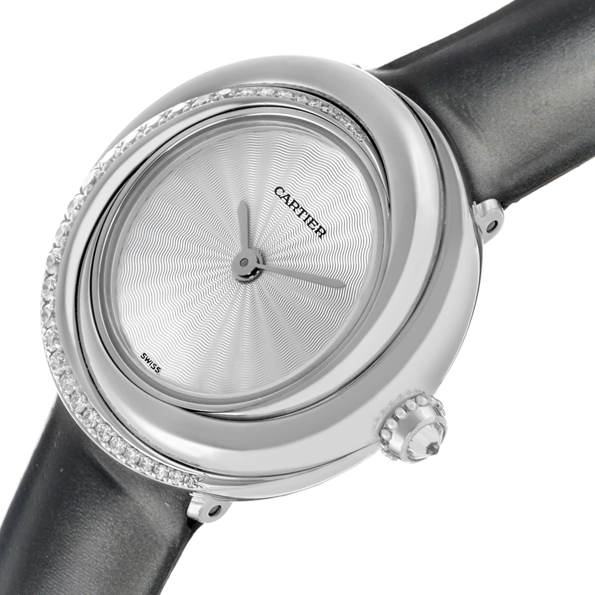 The Cartier Trinity WG201041 Women's White Gold Silver Dial watch is shown from a side angle with the face, bezel, and part of the black strap visible.