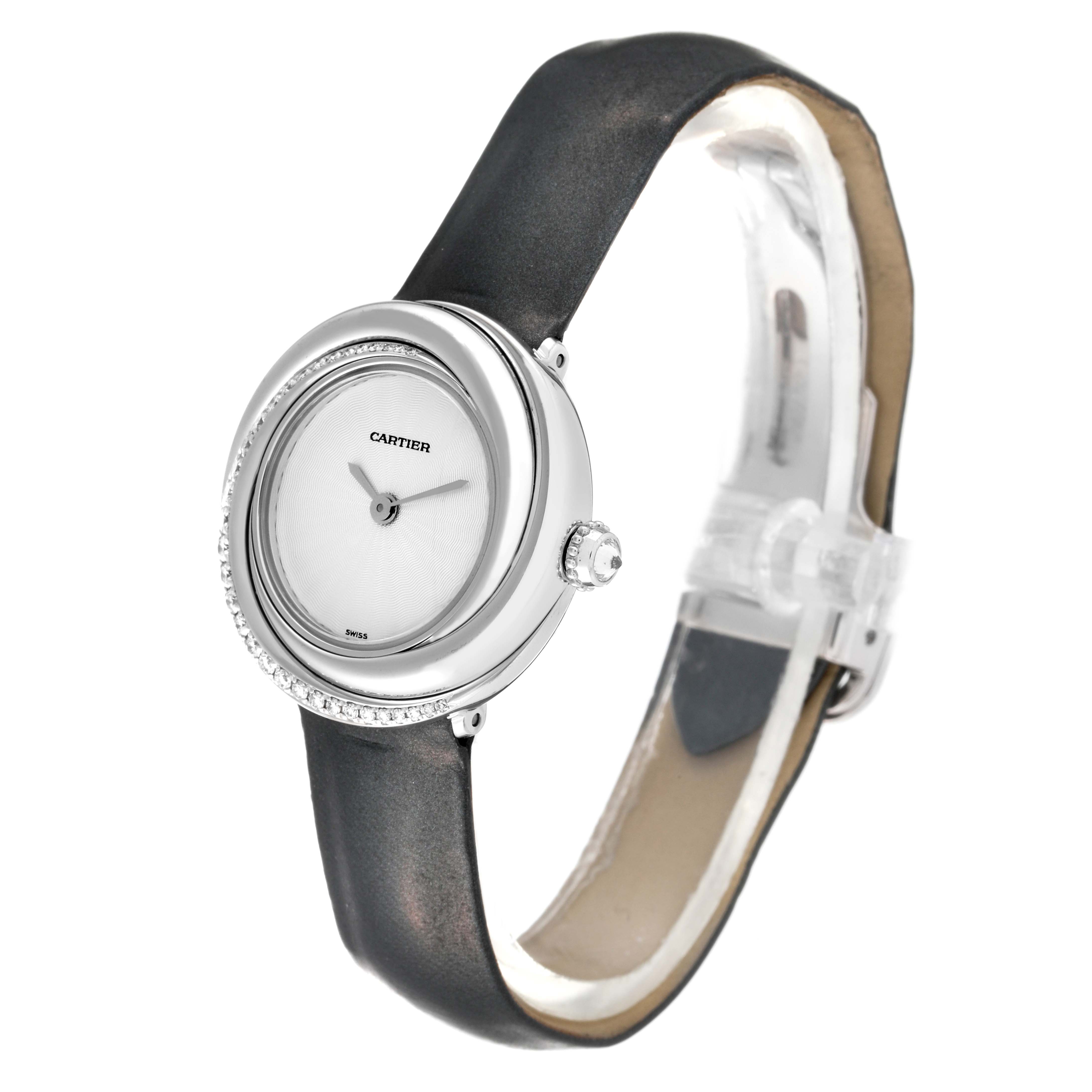 This image shows an angled view of the Cartier Trinity WG201041 Women's White Gold Silver Dial WG201041 Women's White Gold Silver Dial watch, highlighting its round face, bezel, and leather strap.