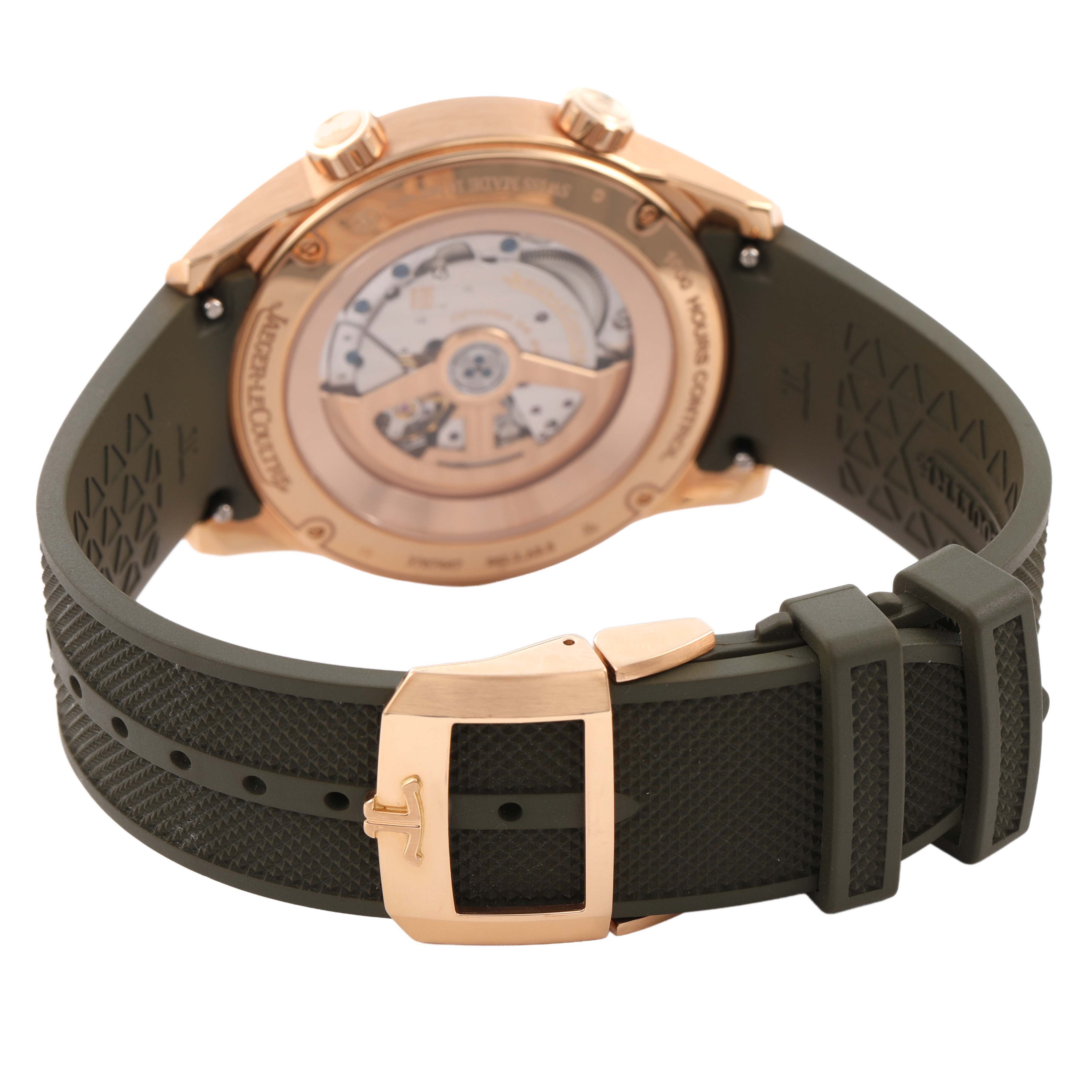 The Jaeger LeCoultre Polaris Q908263J Men's Rose Gold Green Dial watch is shown from the back, highlighting the movement and clasp on a green strap.