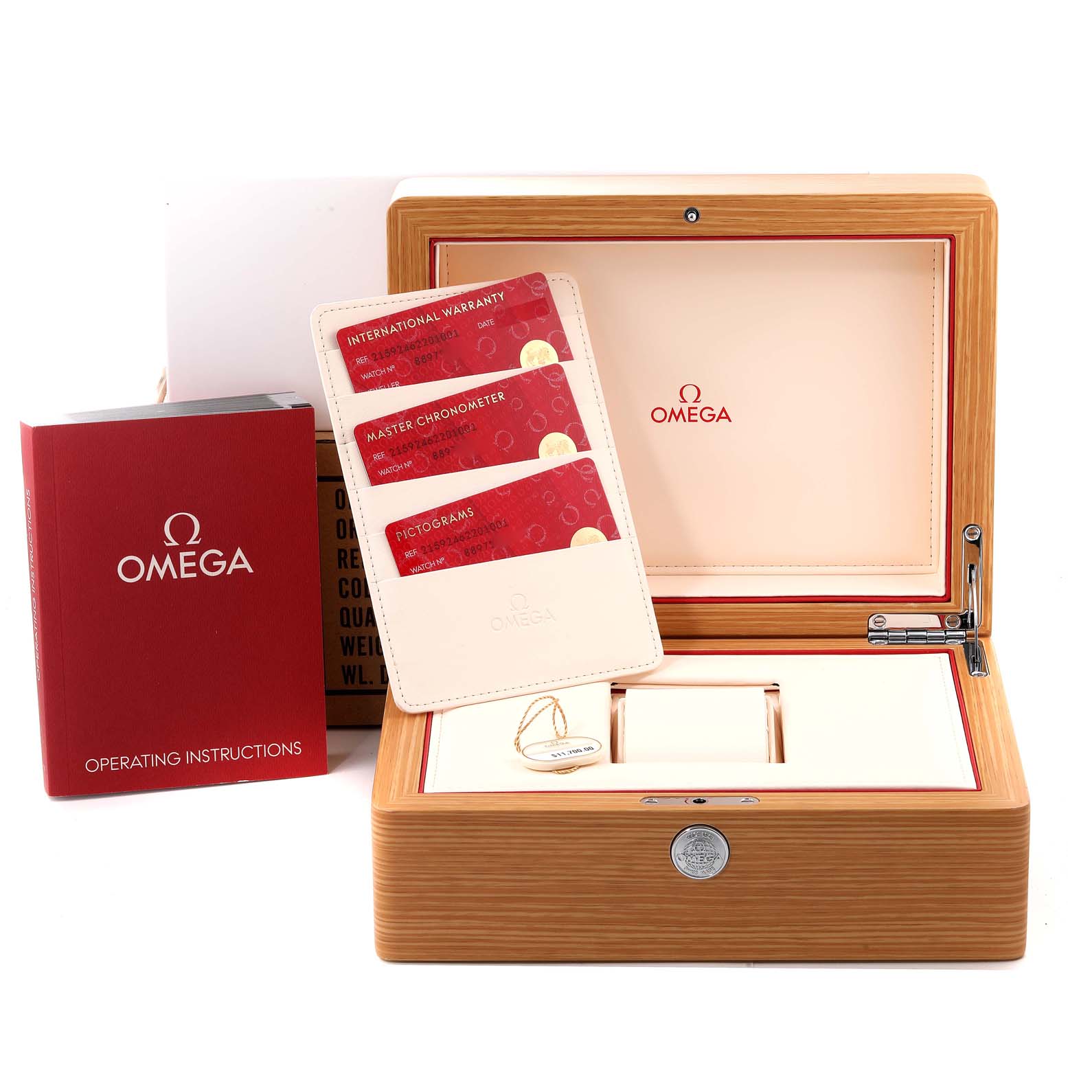 This image shows an open Omega Planet Ocean 215.82.46.22.01.001 Men's Ceramic Black Dial 215.82.46.22.01.001 Men's Ceramic Black Dial watch box with a booklet, warranty cards, and a tag.