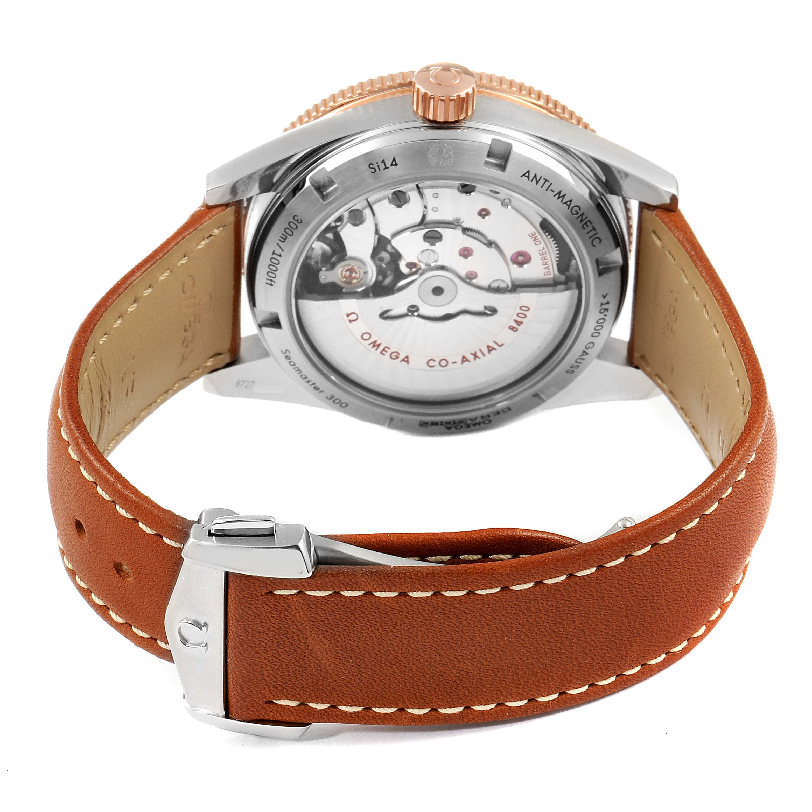 The image shows the back of an Omega Seamaster 233.22.41.21.01.002 Men's Steel and Gold (two tone) Black Dial 233.22.41.21.01.002 Men's Steel and Gold (two tone) Black Dial watch, highlighting its movement and brown leather strap.