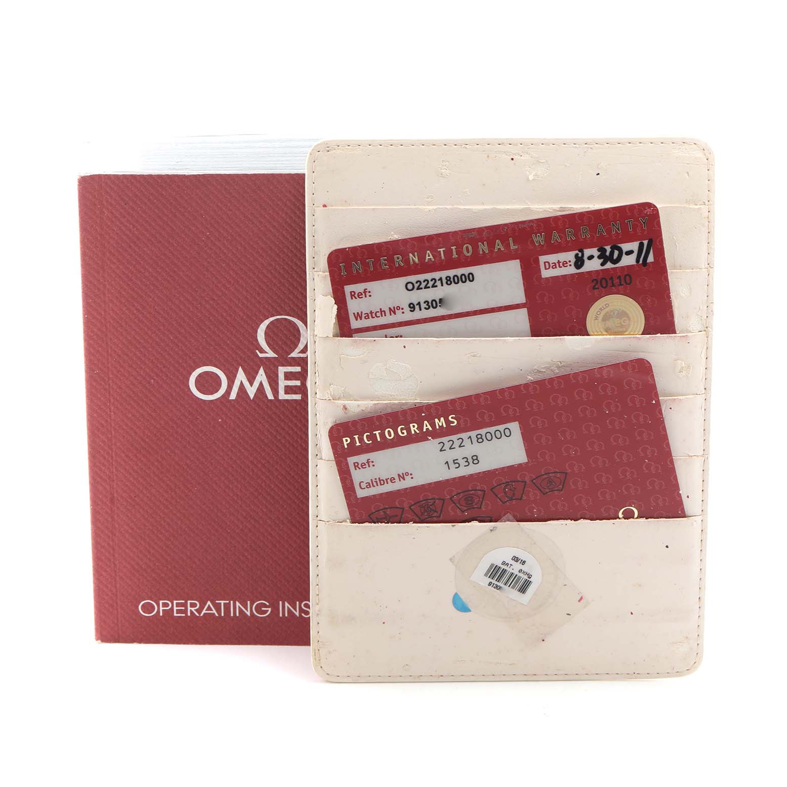 The image shows Omega Seamaster 2221.80.00 Men
s Stainless Steel Blue Dial 2221.80.00 Men
s Stainless Steel Blue Dial accessories, including a red operating instructions booklet and a cardholder with warranty and pictogram cards.