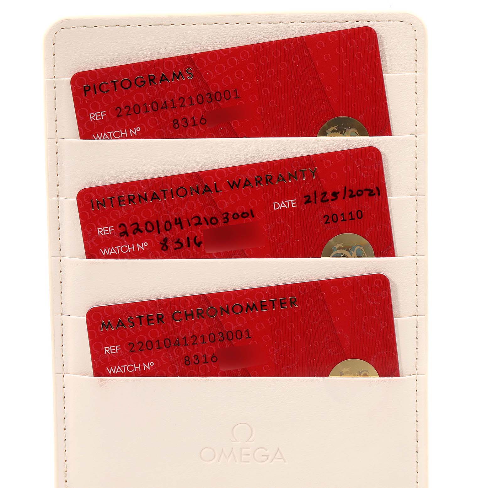 This image shows three red cards in a white cardholder for the Omega Aqua Terra 220.10.41.21.03.001 Men
s Stainless Steel Blue Dial 220.10.41.21.03.001 Men
s Stainless Steel Blue Dial model, including pictograms, international warranty, and master chronometer cards.