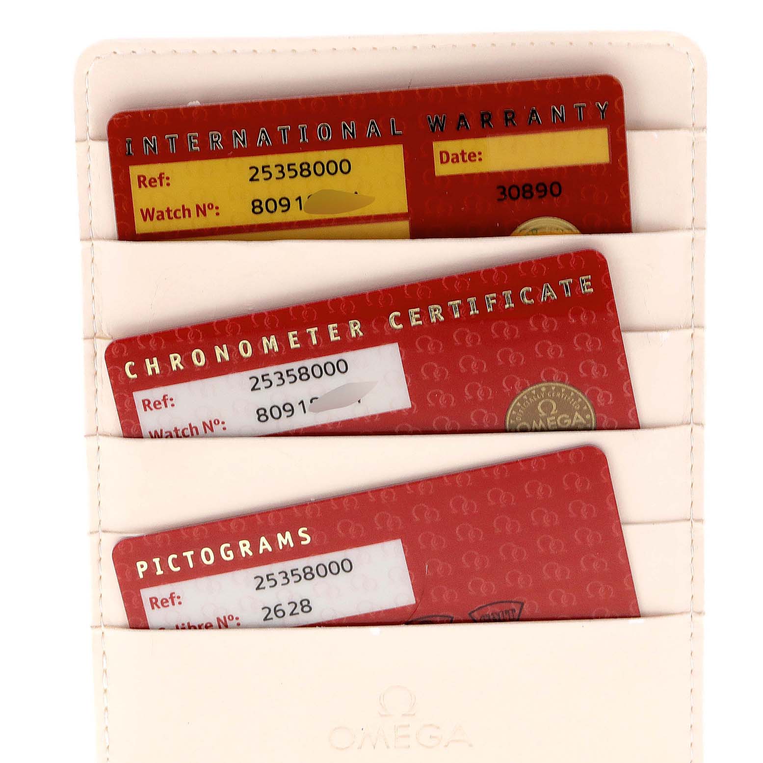 The image shows warranty cards and certificates for an Omega Seamaster 2535.80.00 Men
s Stainless Steel Blue Dial 2535.80.00 Men
s Stainless Steel Blue Dial watch.