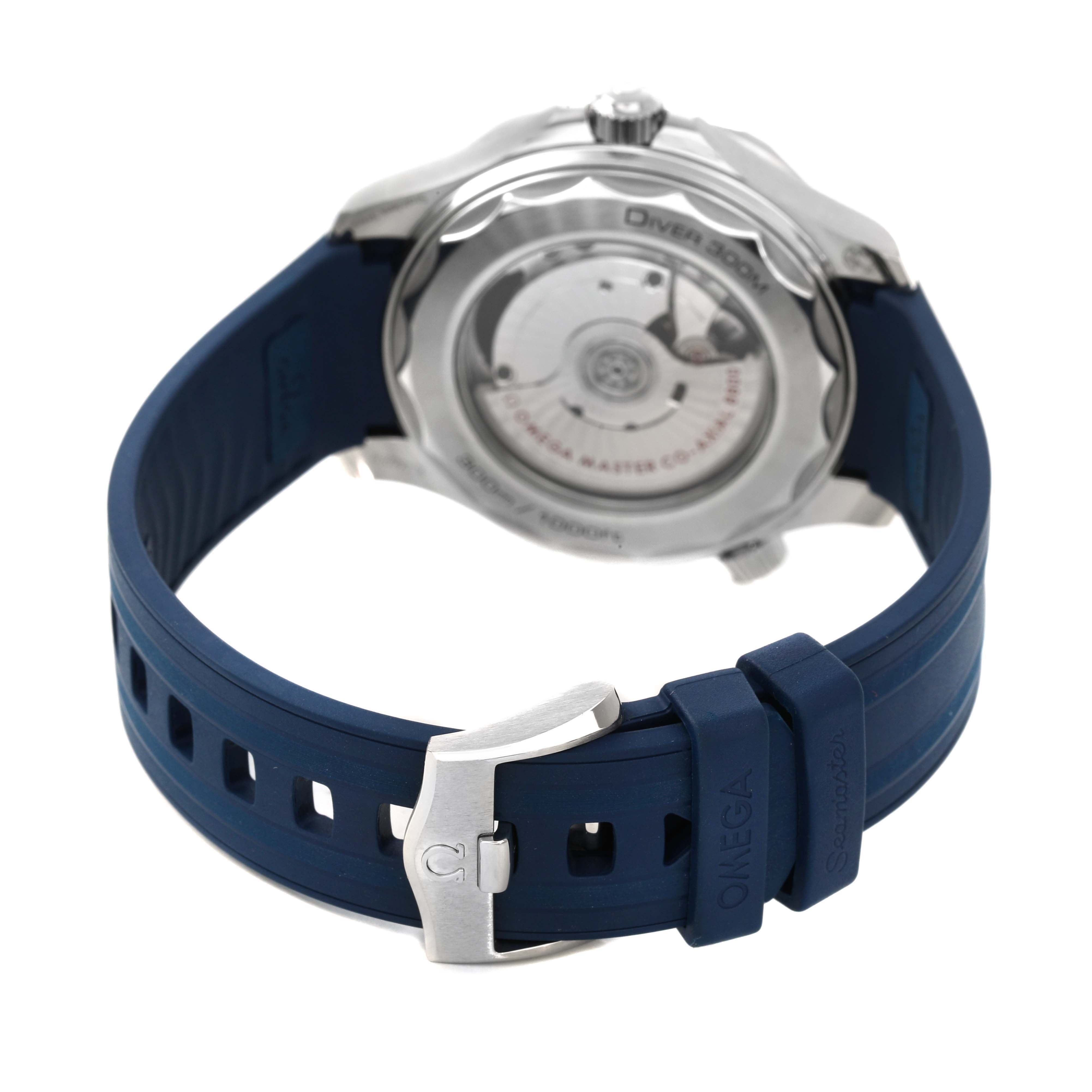 The image shows the back of an Omega Seamaster 210.32.42.20.06.001 Men's Stainless Steel Grey Dial watch with a visible case back and blue rubber strap, featuring the clasp and branding.