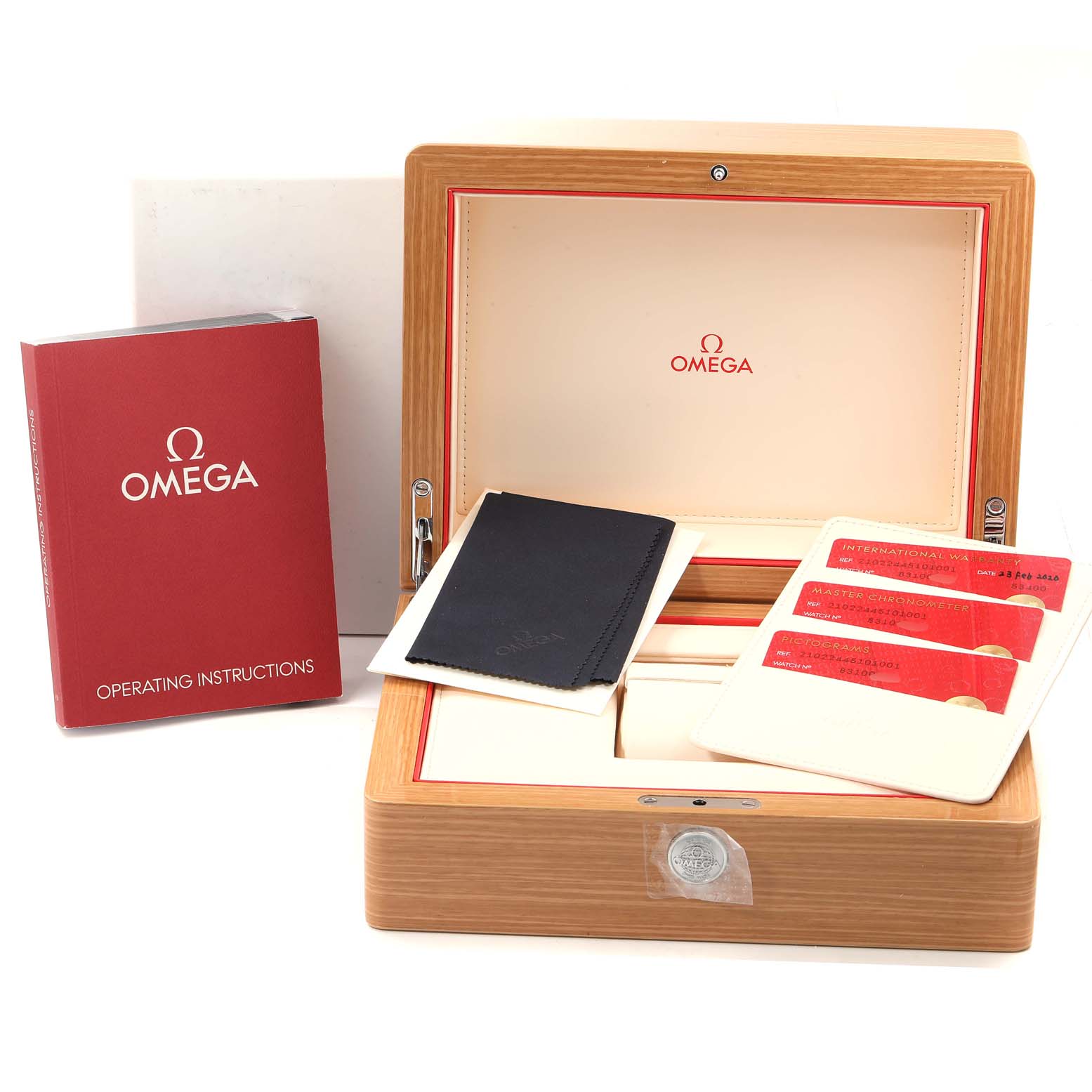 The image shows an Omega Seamaster 210.22.44.51.01.001 Men's Steel and Gold (two tone) Black Dial 210.22.44.51.01.001 Men's Steel and Gold (two tone) Black Dial watch box, operating instructions, warranty cards, and a cleaning cloth from a front angle.