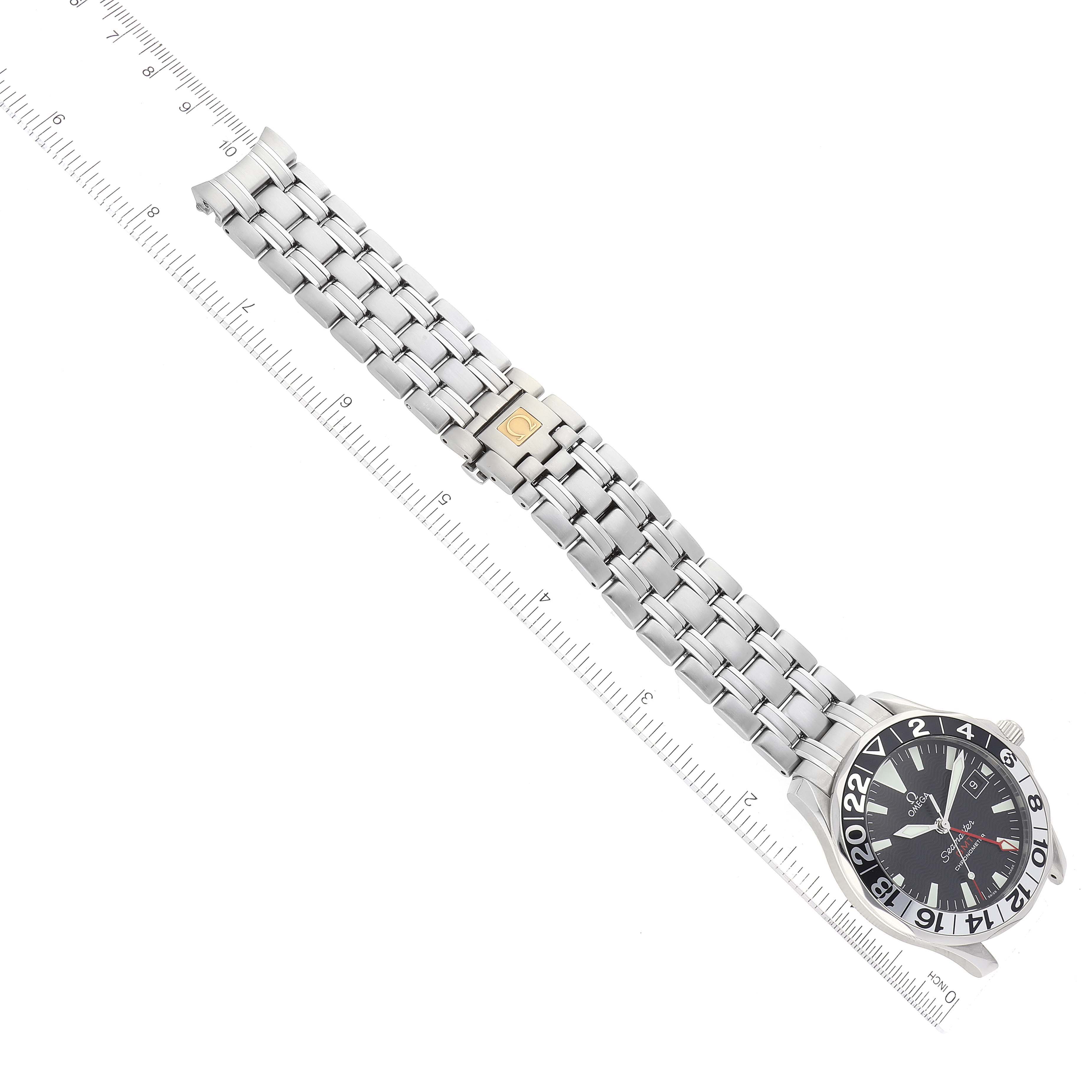 The image shows an Omega Seamaster 2534.50.00 Men's Stainless Steel Black Dial 2534.50.00 Men's Stainless Steel Black Dial watch from an overhead angle, featuring its bracelet and face, alongside a measuring ruler.