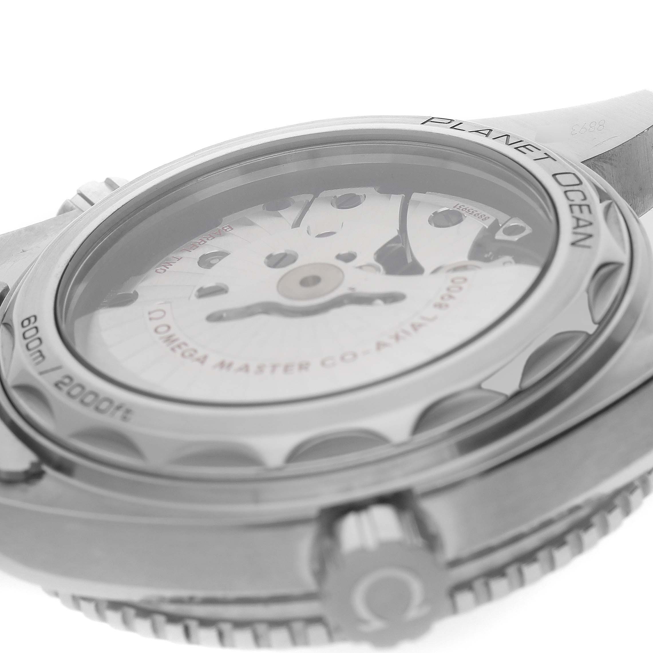 The image shows the back of the Omega Planet Ocean 215.30.44.21.03.001 Men's Stainless Steel Blue Dial watch, highlighting its transparent case back and visible movement.