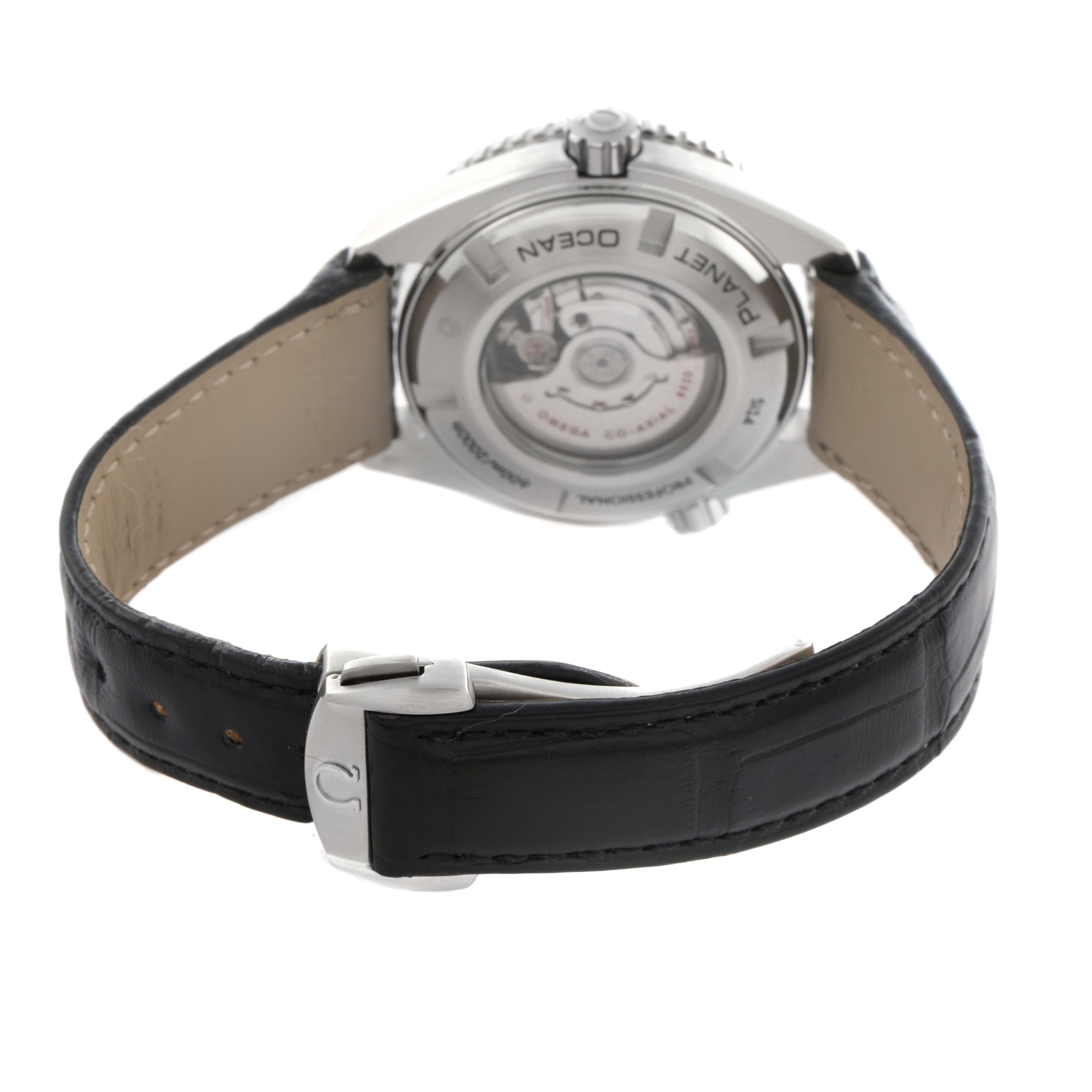 The Omega Planet Ocean 232.33.38.20.01.002 Men
s Stainless Steel Black Dial 232.33.38.20.01.002 Men
s Stainless Steel Black Dial watch is shown from the back, highlighting the case back and leather strap with buckle.