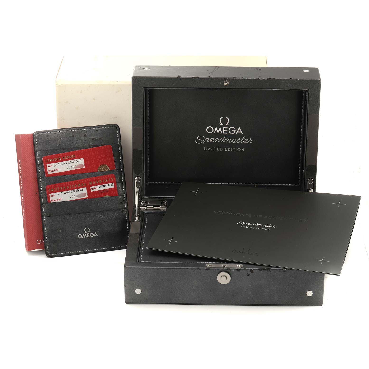 The image shows the box, certificates, and cardholder for the Omega Speedmaster 311.30.42.30.99.001 Men
s Stainless Steel Silver Dial 311.30.42.30.99.001 Men
s Stainless Steel Silver Dial Limited Edition watch.