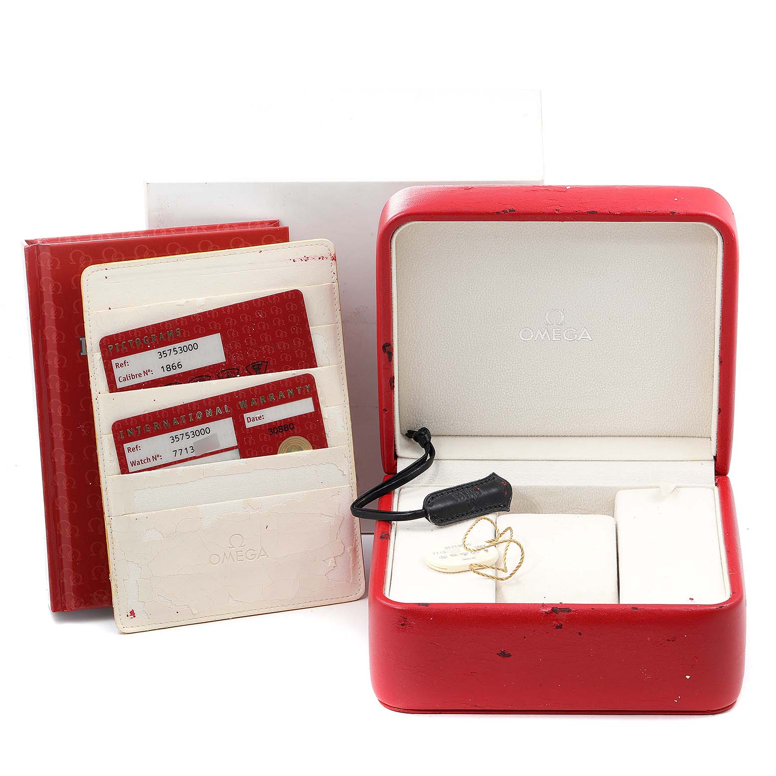 The image shows the packaging, warranty cards, and empty watch boxes for an Omega Speedmaster 3575.30.00 Men
s Stainless Steel Silver Dial 3575.30.00 Men
s Stainless Steel Silver Dial.