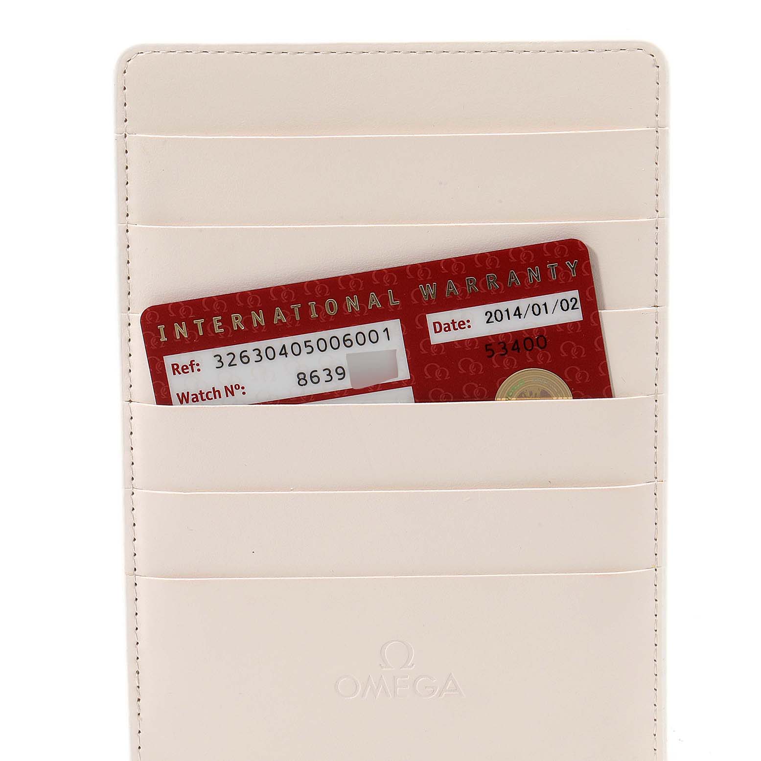 The image shows the warranty card for an Omega Speedmaster 326.30.40.50.06.001 Men
s Stainless Steel Grey Dial 326.30.40.50.06.001 Men
s Stainless Steel Grey Dial watch, placed in a white cardholder.