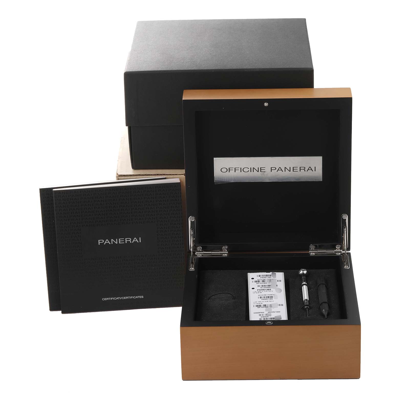 The image shows the packaging and accessories for the Panerai Submersible PAM01389 Men's Titanium Black Dial PAM01389 Men's Titanium Black Dial watch, including the box, booklet, and tools.