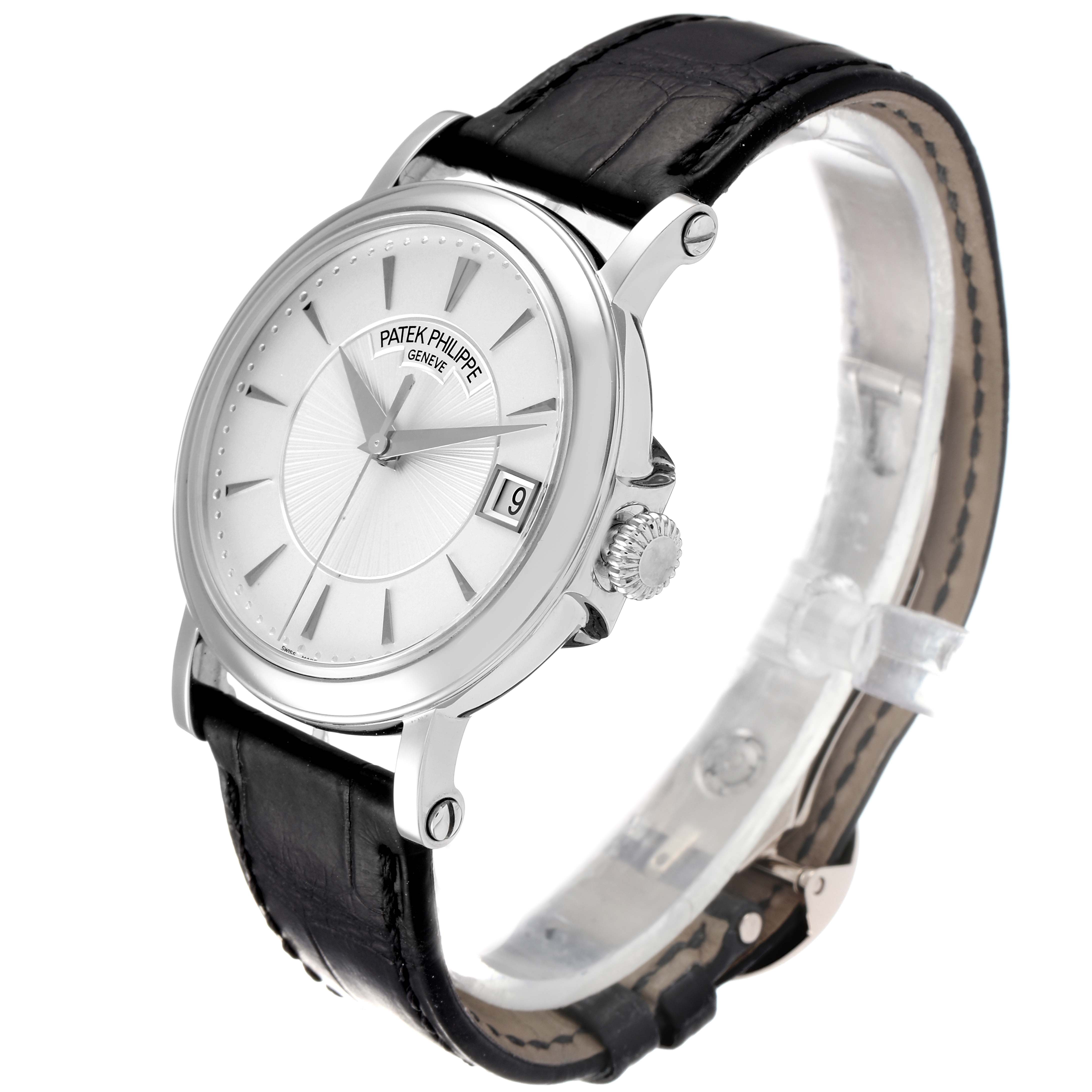 This is a Patek Philippe Calatrava 5153G Men
s White Gold Silver Dial 5153G Men
s White Gold Silver Dial watch shown from an angled side view, displaying the face, crown, and leather strap.