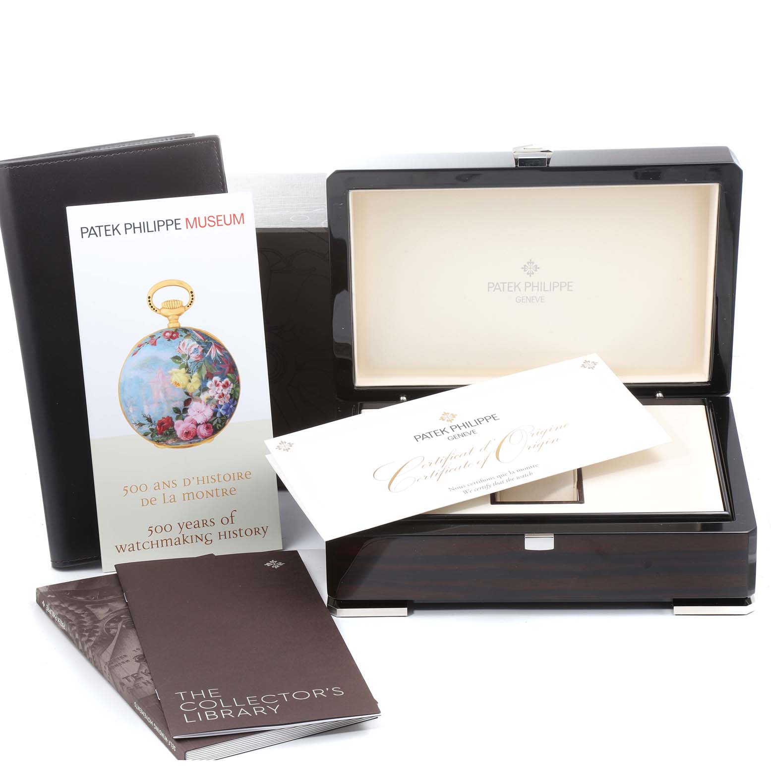 The image shows the packaging, manuals, and certificate for the Patek Philippe Calatrava 5153G Men
s White Gold Silver Dial 5153G Men
s White Gold Silver Dial watch, including an open box.