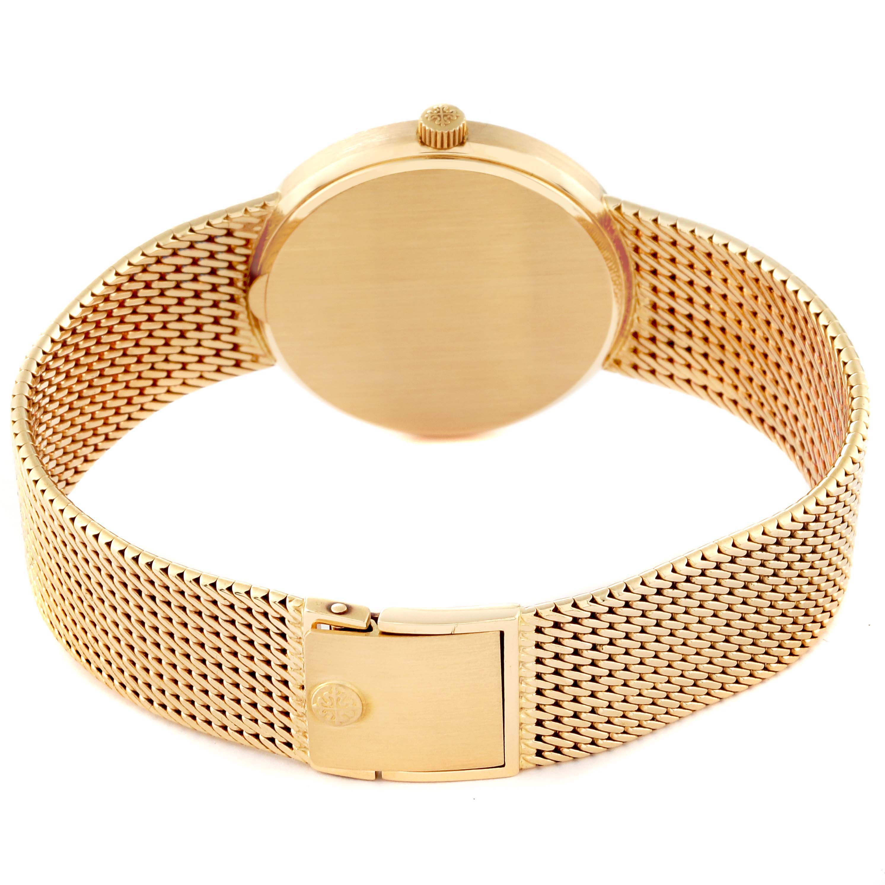The image shows the back and clasp of a Patek Philippe Calatrava 3802 Men
s Yellow Gold White Dial 3802 Men
s Yellow Gold White Dial watch in gold with a mesh bracelet.
