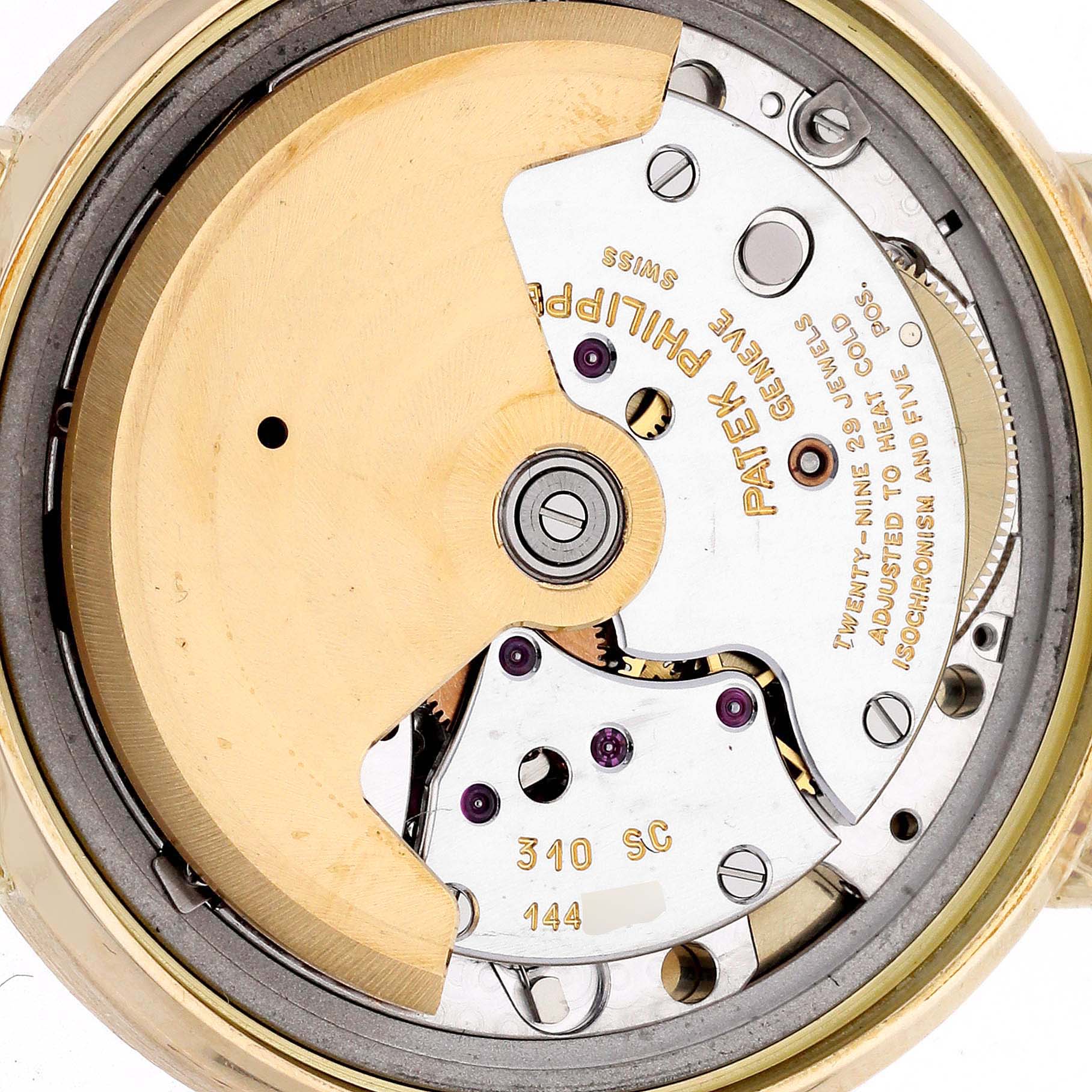 The image shows a close-up of the movement and inner workings of a Patek Philippe Calatrava 3802 Men
s Yellow Gold White Dial 3802 Men
s Yellow Gold White Dial watch.