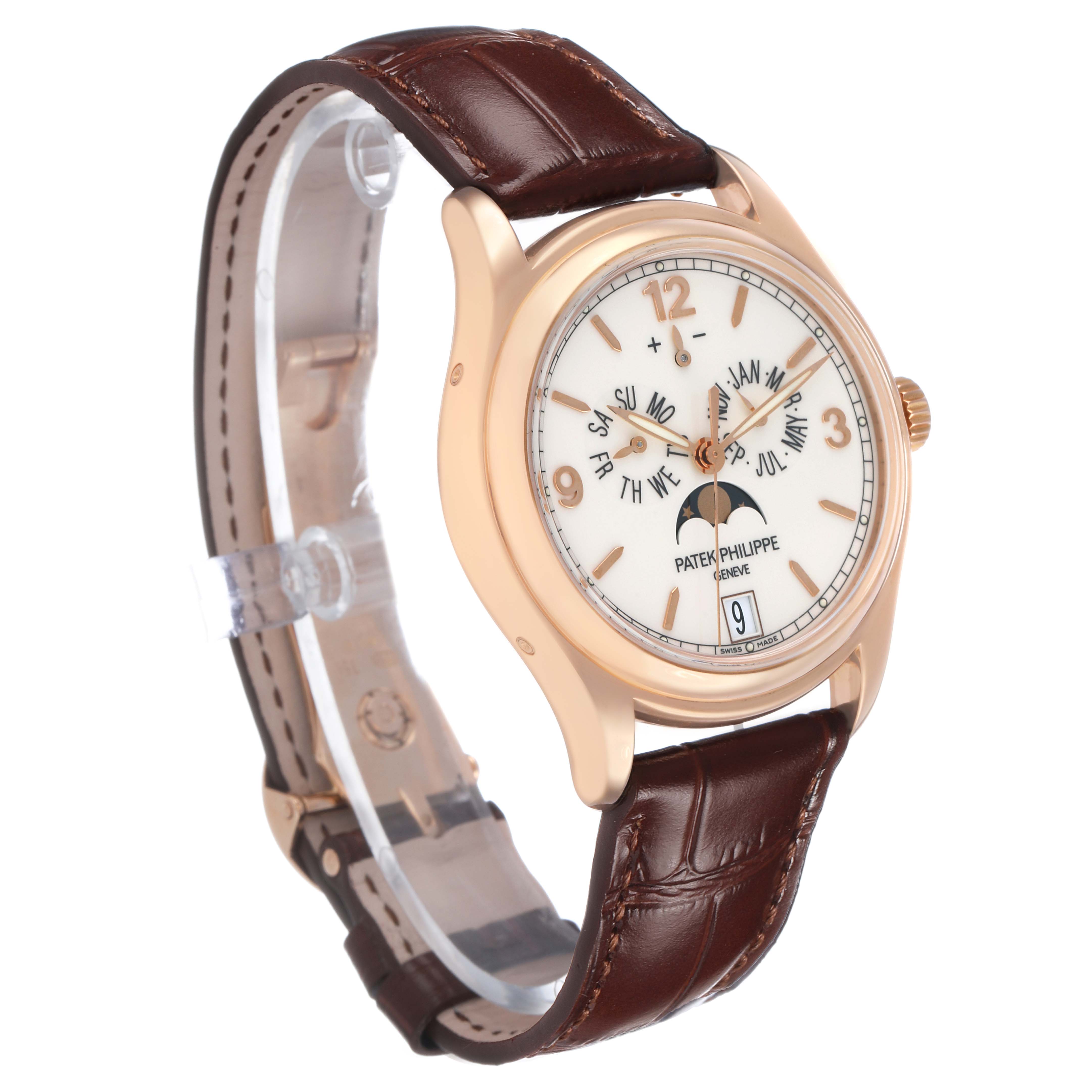 The Patek Philippe Complications 5146R-001 Men's Rose Gold White Dial watch is shown at a three-quarter angle, featuring a brown leather strap and a detailed dial with calendar functions.