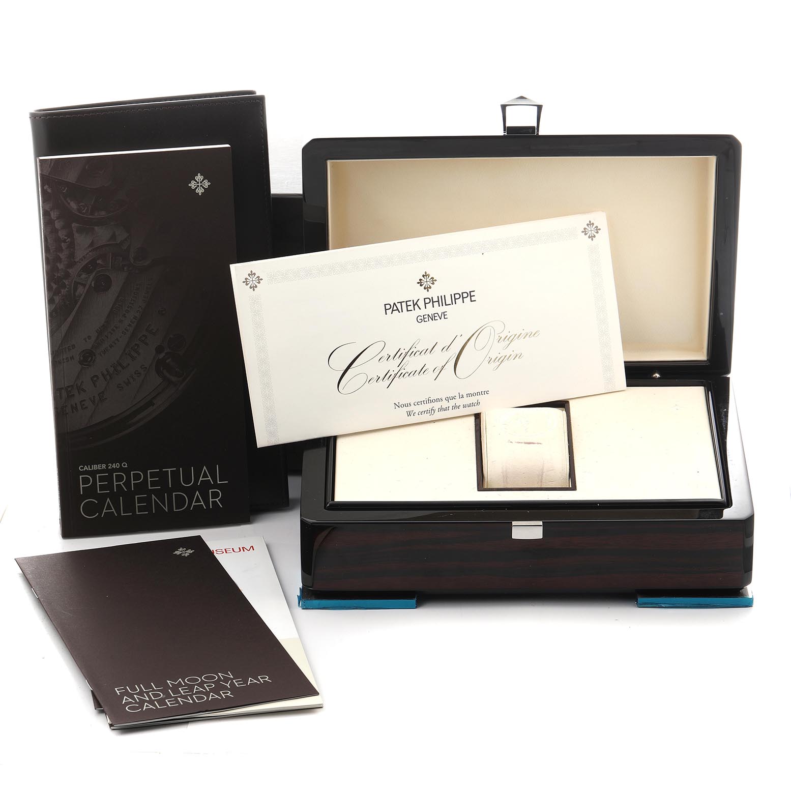 The image shows a Patek Philippe Complications 5327R Men
s Rose Gold Beige Dial 5327R Men
s Rose Gold Beige Dial box, certificates, and booklets, viewed from the front.