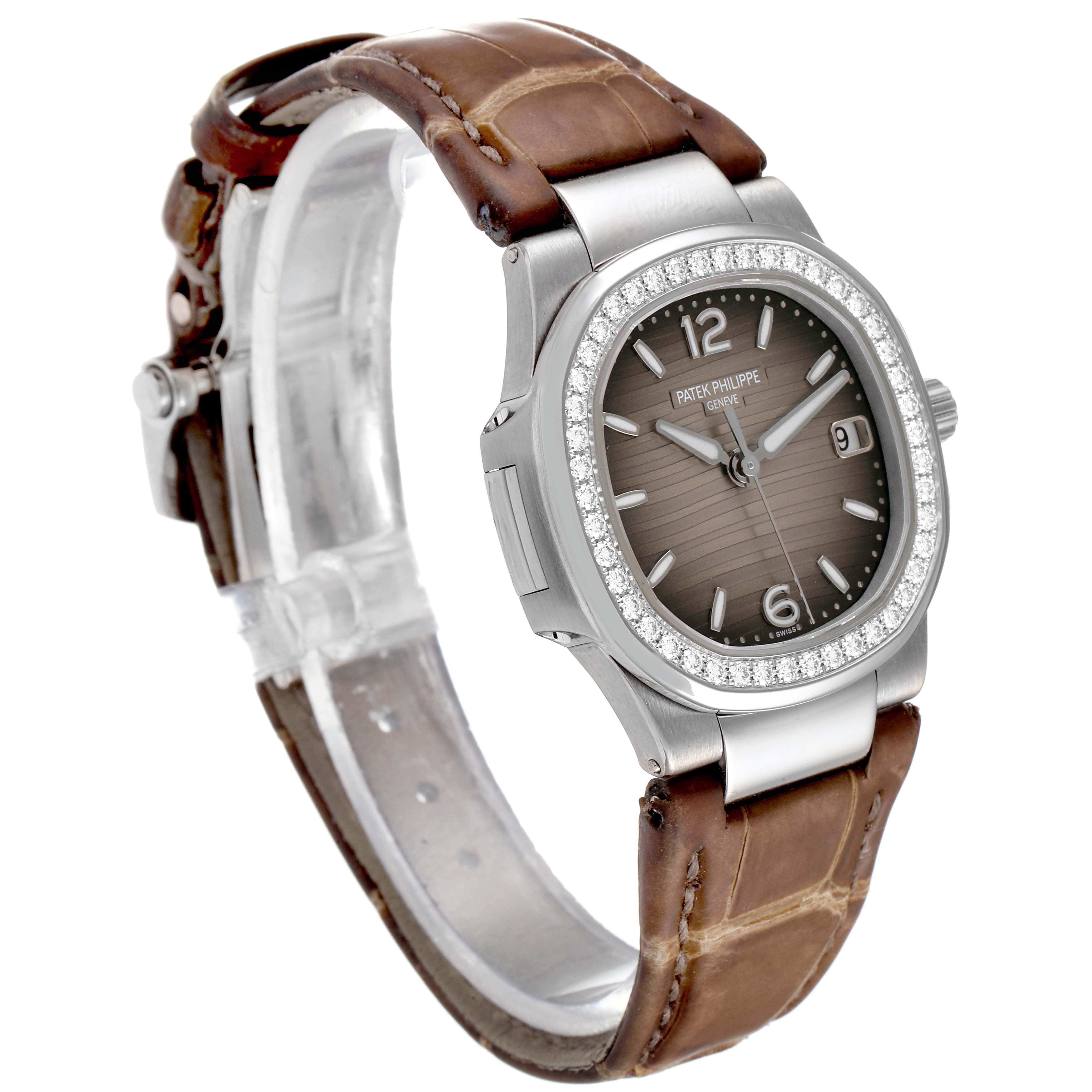 The image shows a side-angle view of a Patek Philippe Nautilus 7010G Women's White Gold Grey Dial 7010G Women's White Gold Grey Dial watch, highlighting the dial, bezel, and leather strap.