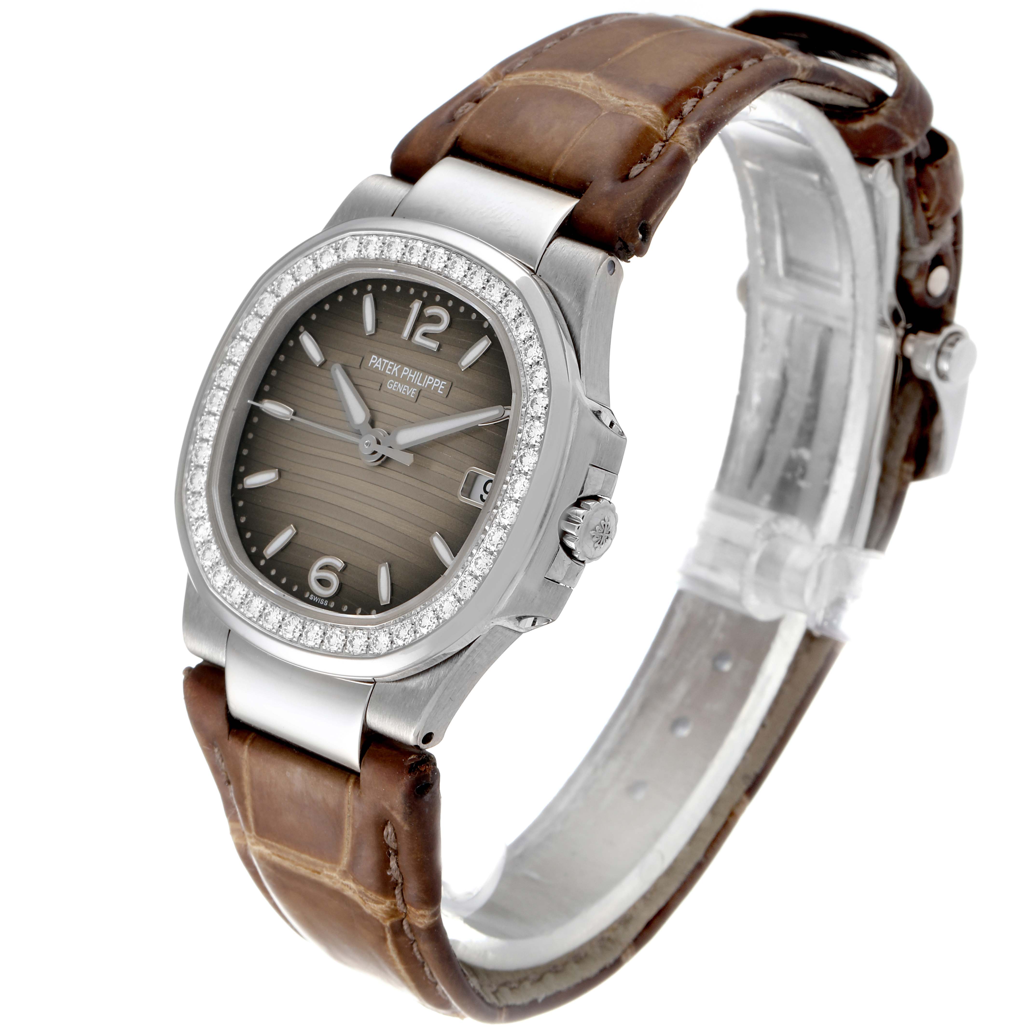 This image shows a Patek Philippe Nautilus 7010G Women's White Gold Grey Dial 7010G Women's White Gold Grey Dial watch at an angle highlighting its face, bezel, crown, and brown leather strap.