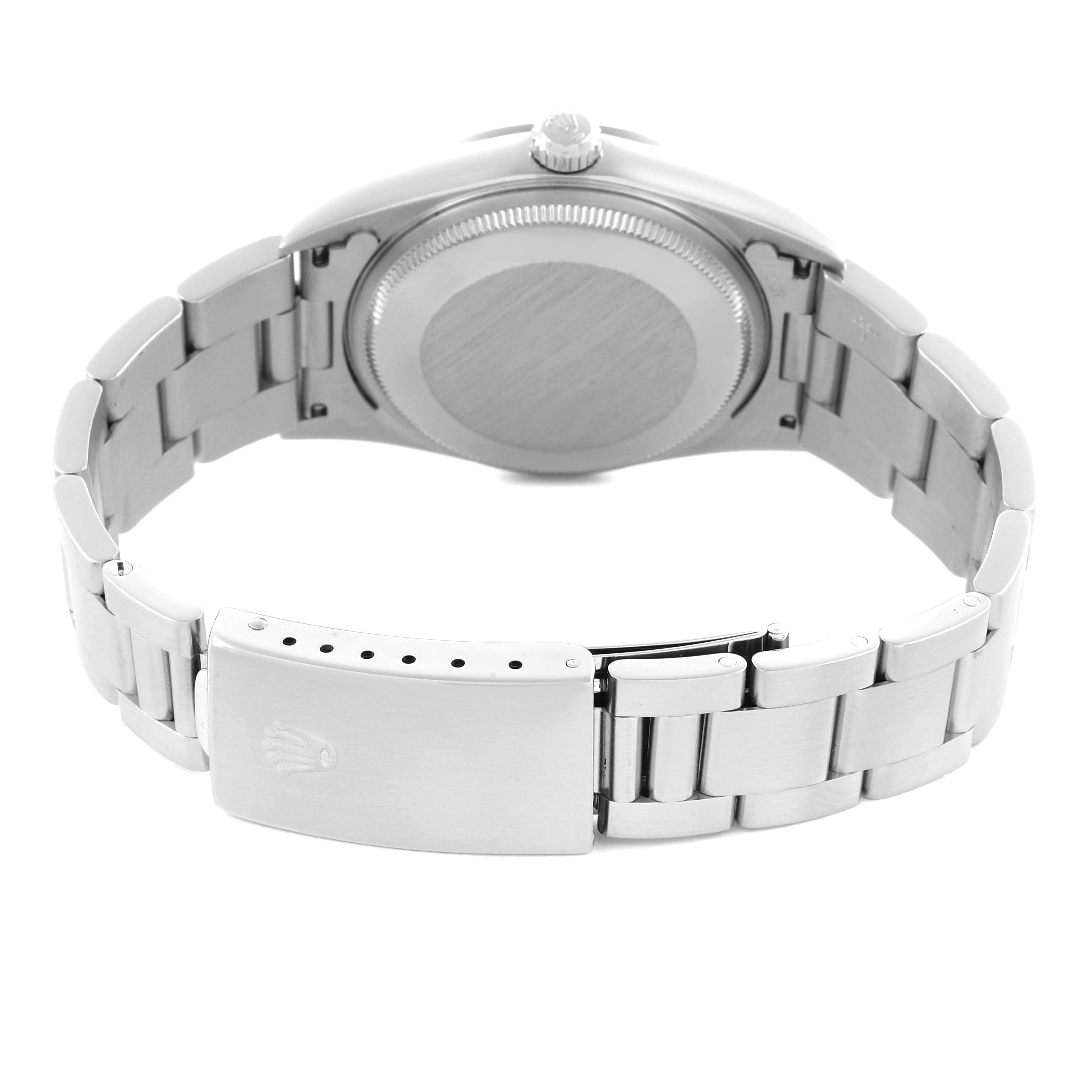 The image shows the back and bracelet clasp of the Rolex Air-King 14000 Men's Stainless Steel Blue Dial, highlighting the case back and metallic bracelet.