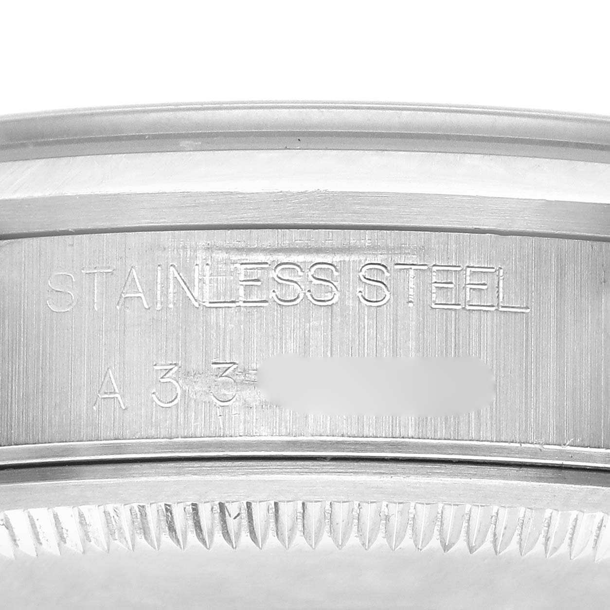 The image shows an angled view of the Rolex Air-King 14000 Men's Stainless Steel Blue Dial's case side, highlighting the steel engravings.