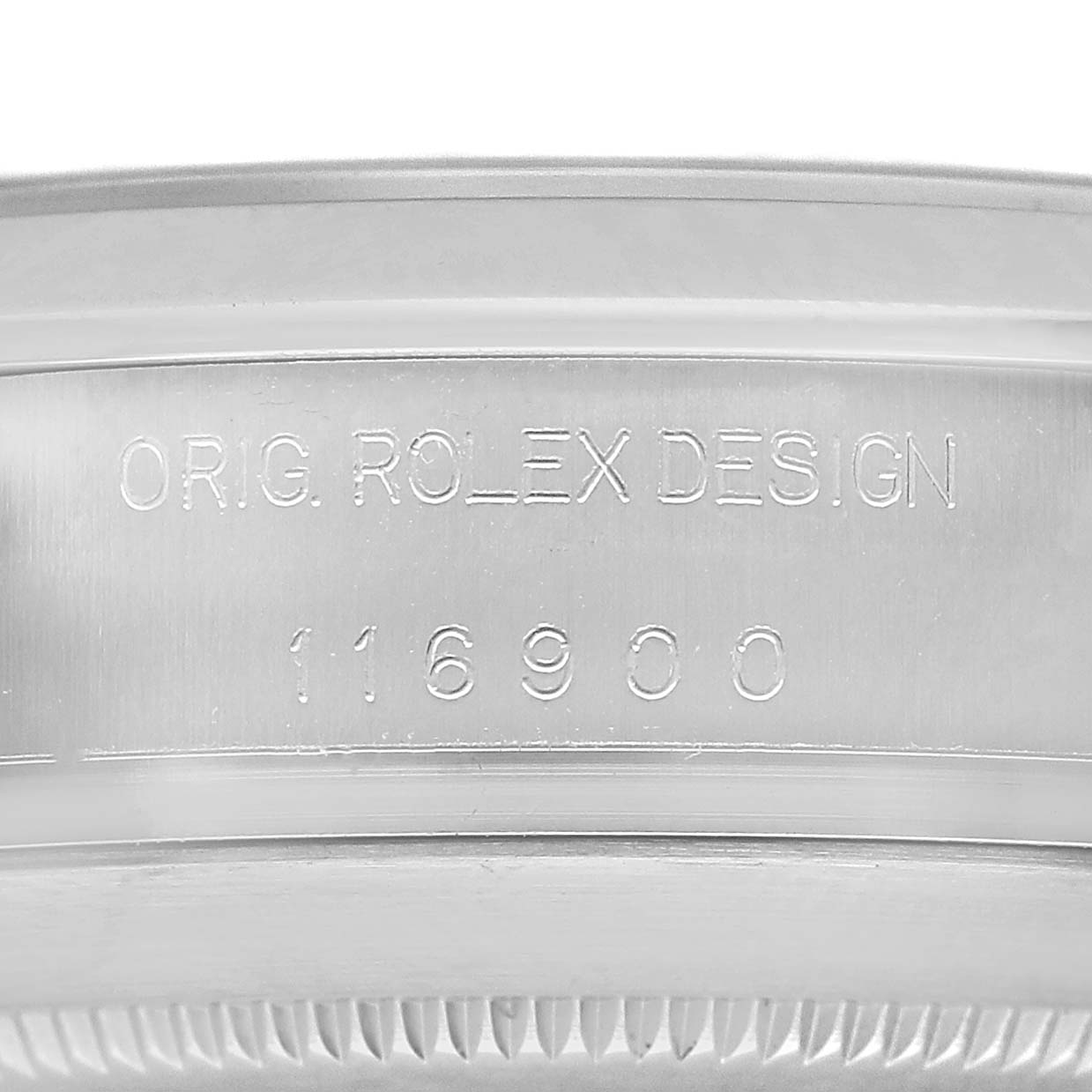 The image shows a close-up of the rim and engraved serial number of a Rolex Air-King 116900 Men's Stainless Steel Black Dial watch.