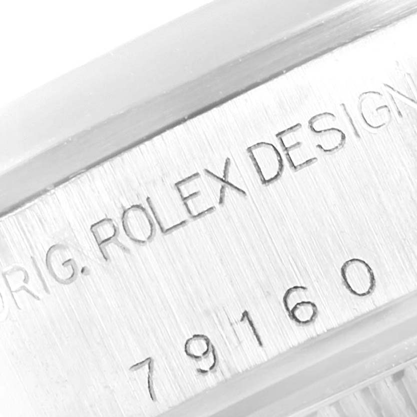 The image shows an angled close-up of the engraving on the side of the case of a Rolex Date 79160 Women
s Stainless Steel White Dial 79160 Women
s Stainless Steel White Dial model watch.