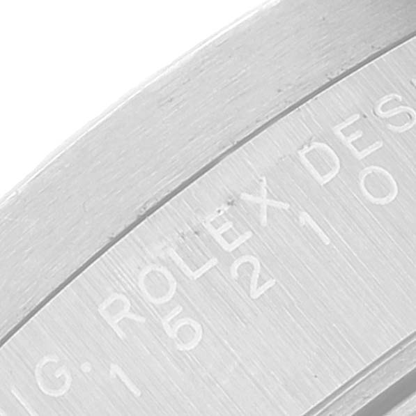 The image shows a close-up of the engravings on the side of the bezel of a Rolex Date 15210 Men's Stainless Steel Black Dial 15210 Men's Stainless Steel Black Dial watch.