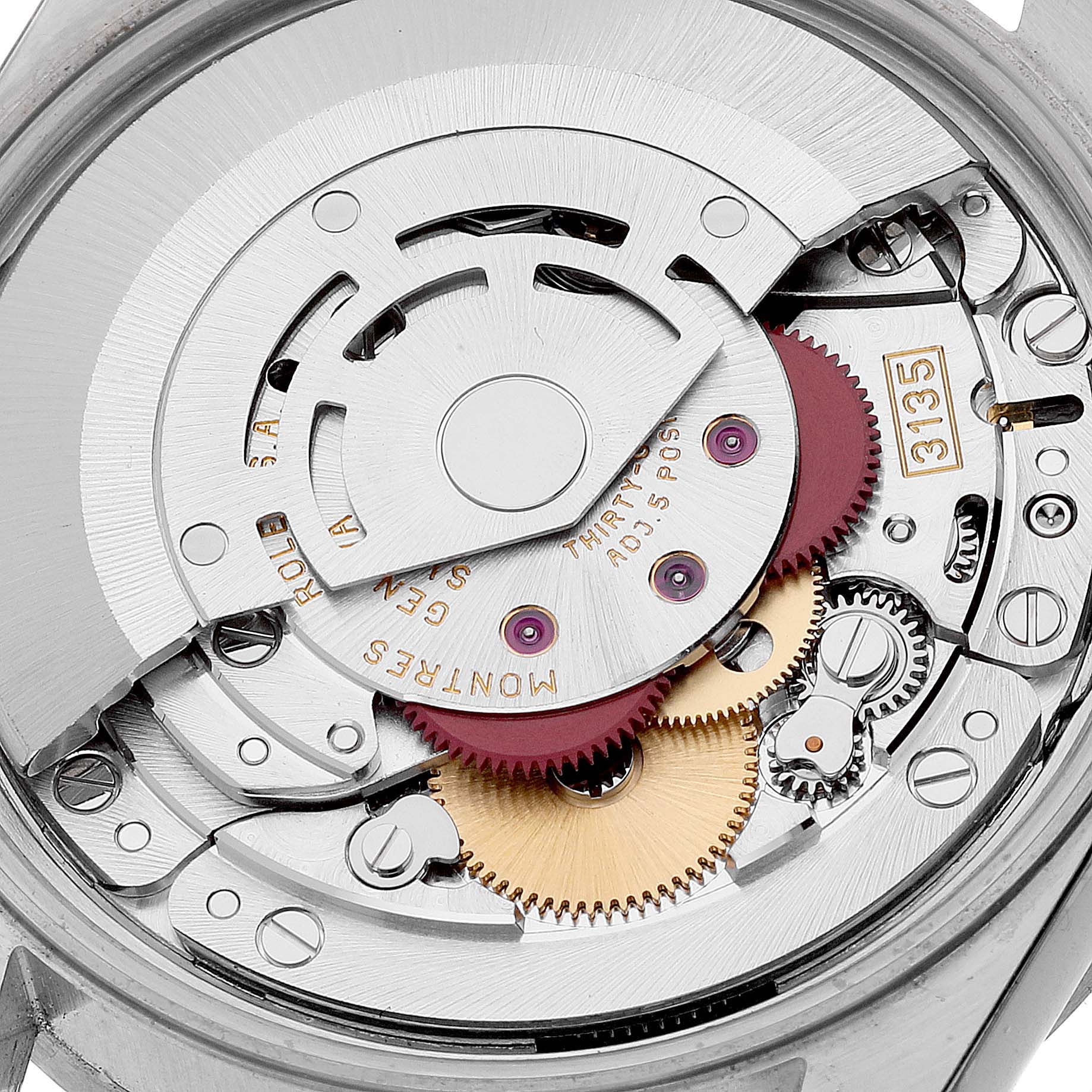 The image shows a close-up view of the movement inside a Rolex Date 15210 Men's Stainless Steel Black Dial 15210 Men's Stainless Steel Black Dial model watch, highlighting the gears and mechanical components.