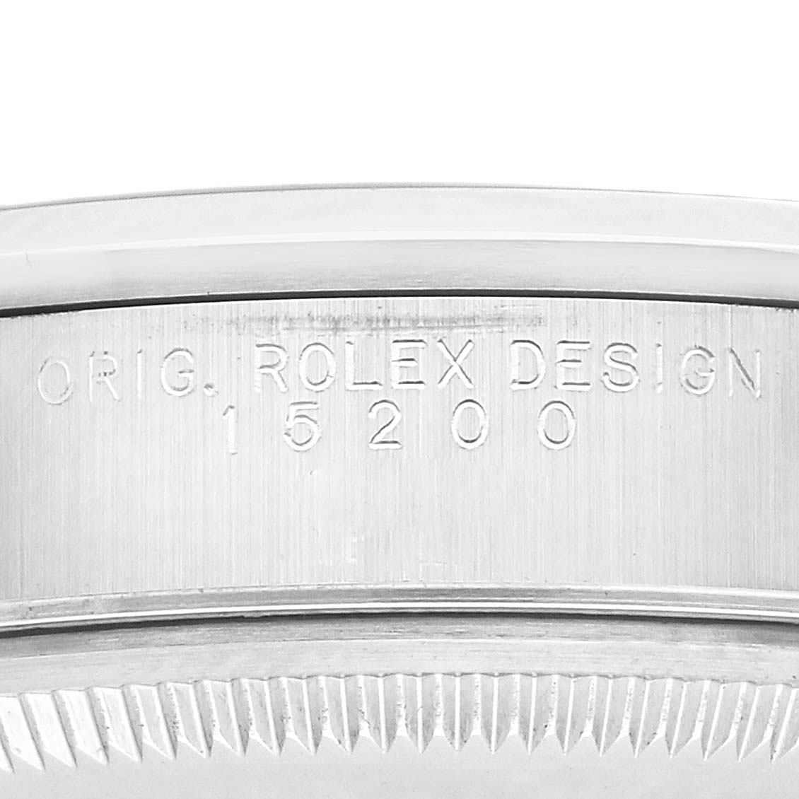 The image shows the side of a Rolex Date 15200 Men's Stainless Steel Silver Dial model, focusing on the engraved serial and model numbers.