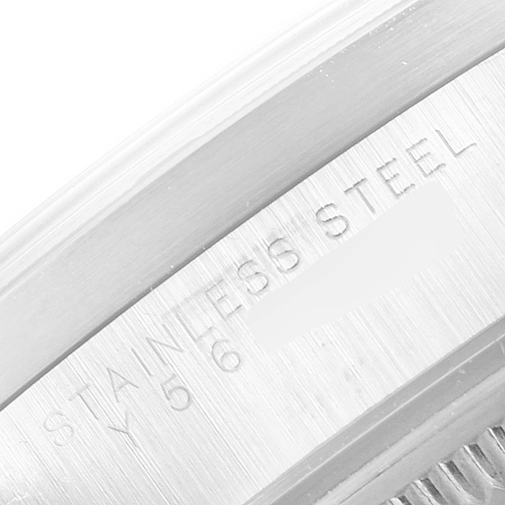 The image shows a close-up of the side engraving on a stainless steel Rolex Date 15210 Men's Stainless Steel White Dial 15210 Men's Stainless Steel White Dial model watch.