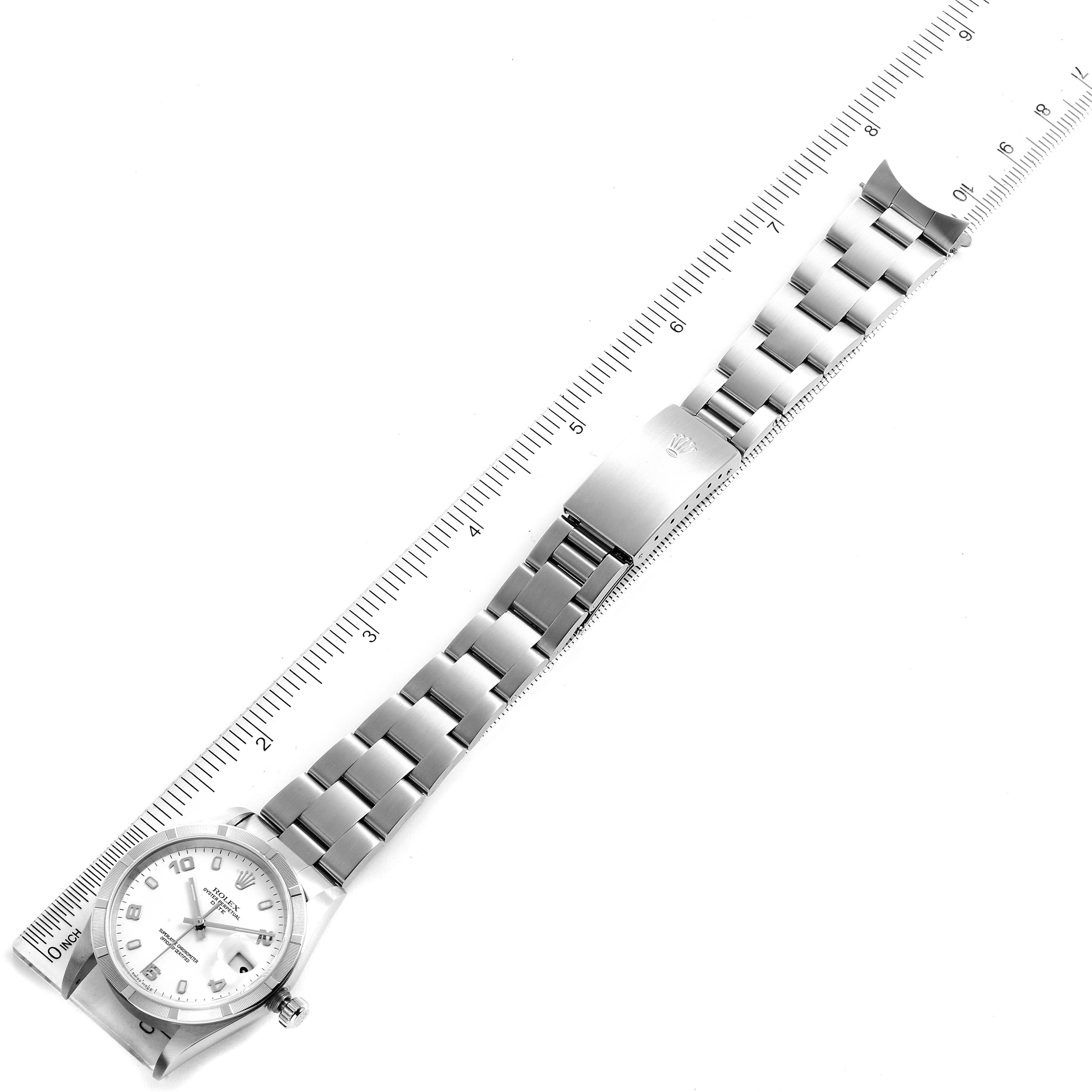 The image shows a Rolex Date 15210 Men's Stainless Steel White Dial 15210 Men's Stainless Steel White Dial watch laid flat, including the face, bracelet, and clasp, photographed alongside a ruler.