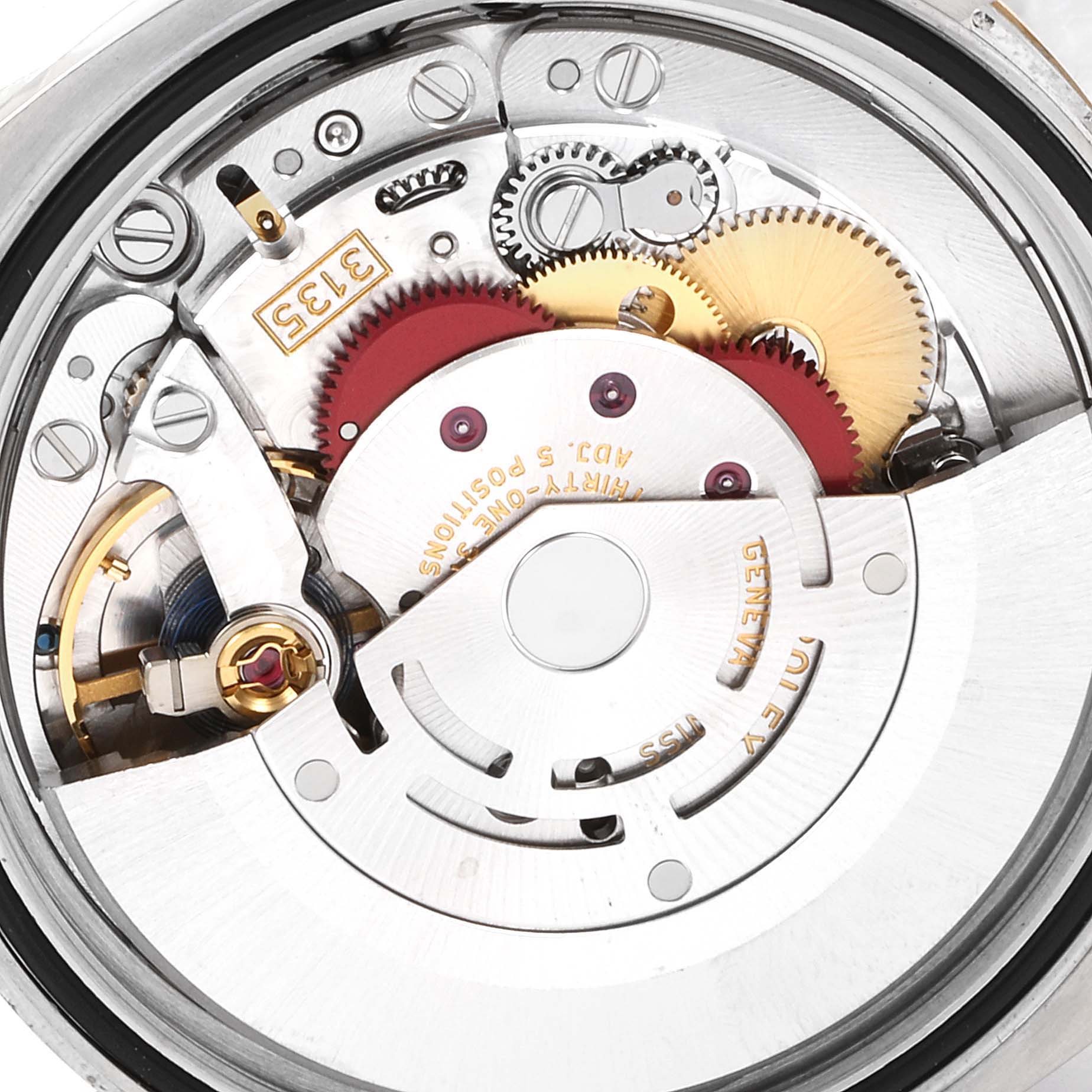 This image shows the intricate internal mechanical movement of a Rolex Datejust 116233 Men's Steel and Gold (two tone) Black Dial 116233 Men's Steel and Gold (two tone) Black Dial watch from a close-up angle.