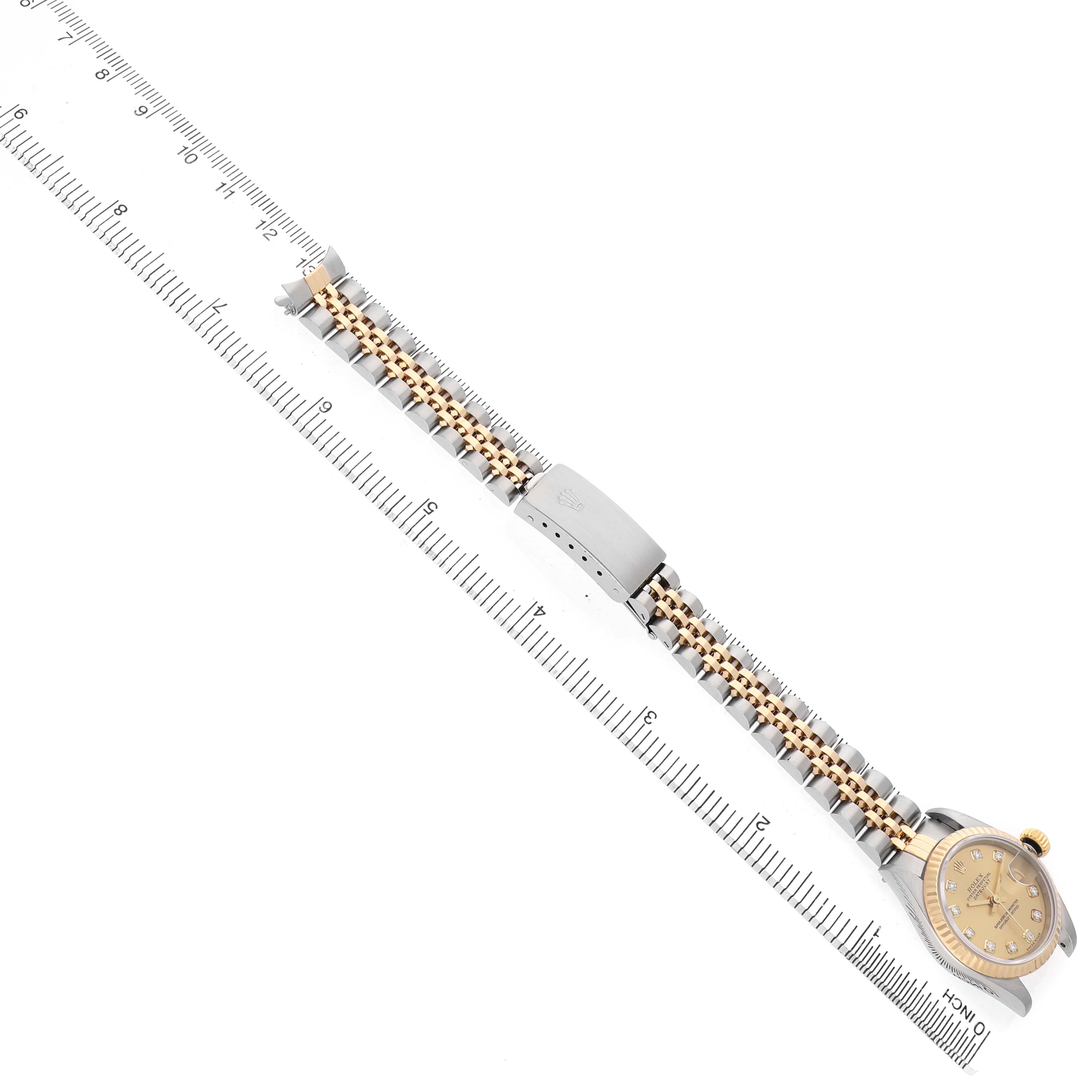 The Rolex Datejust 79173 Women's Stainless Steel Champagne Dial watch is shown from a top-down angle, highlighting the full bracelet and bezel.