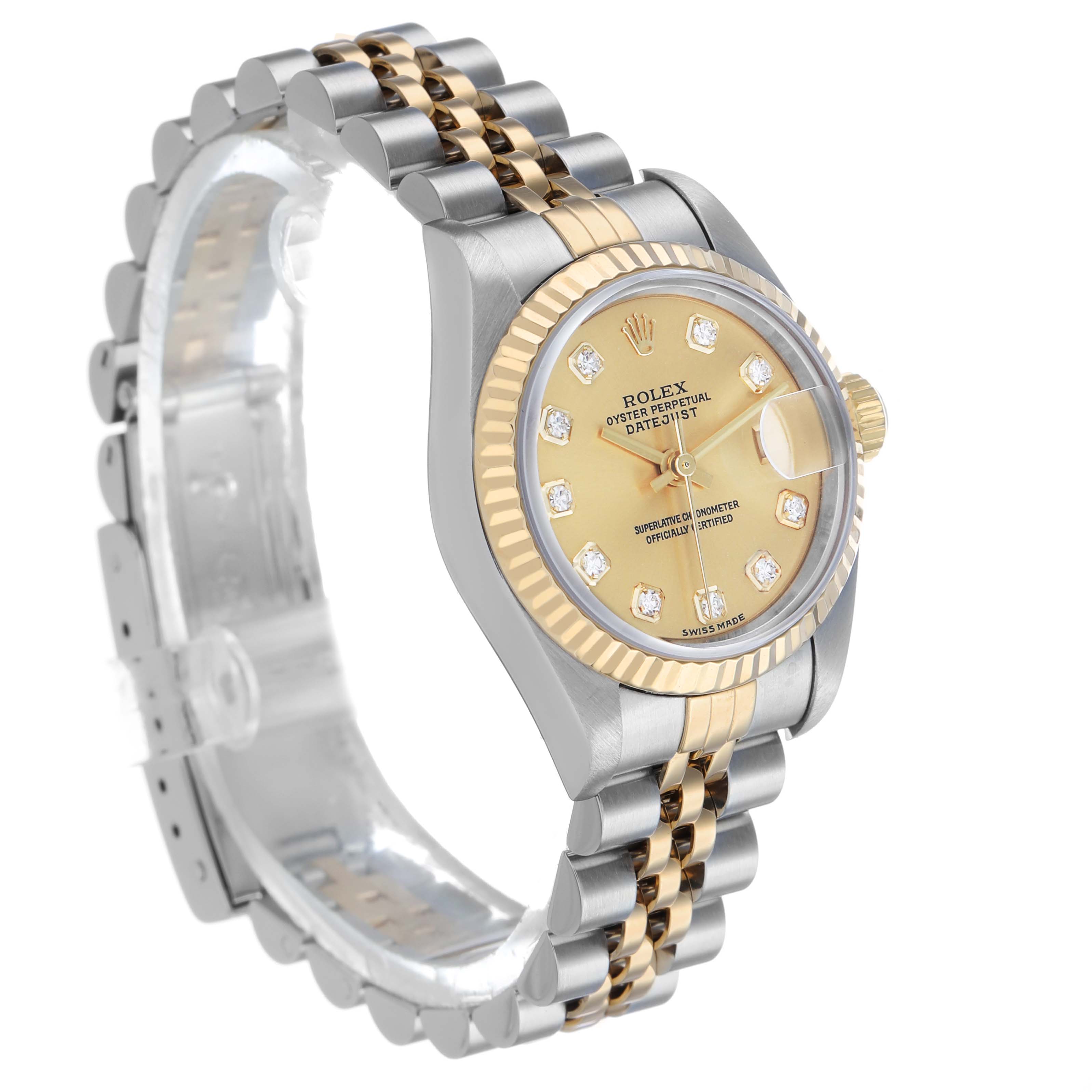 The Rolex Datejust 79173 Women's Stainless Steel Champagne Dial watch is shown at an angled view, highlighting the two-tone bracelet, fluted bezel, and champagne diamond-set dial.