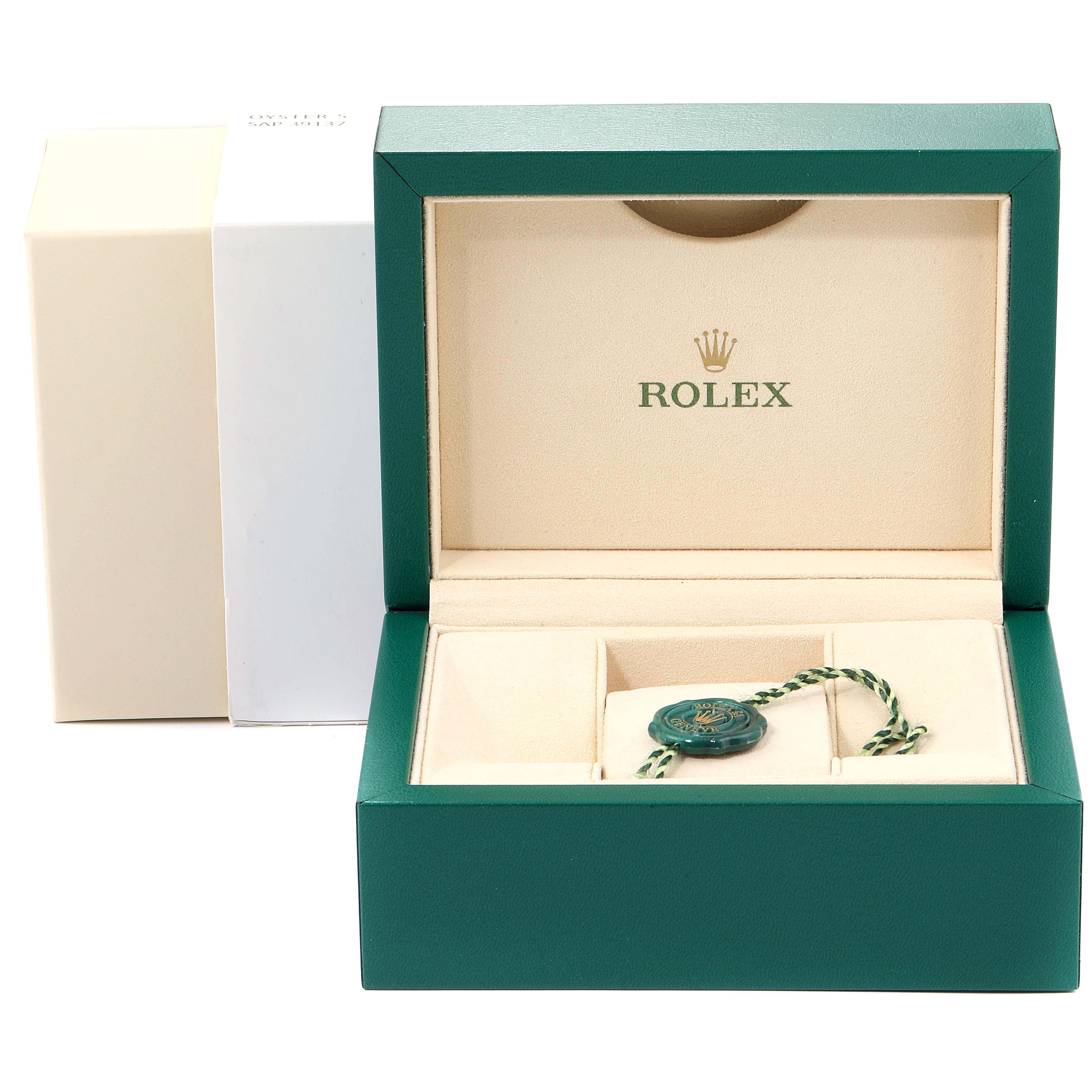 The image shows an empty green Rolex Datejust 179383 Women
s Steel and Gold (two tone) Mother of Pearl Dial 179383 Women
s Steel and Gold (two tone) Mother of Pearl Dial watch box with a green and white tag inside.