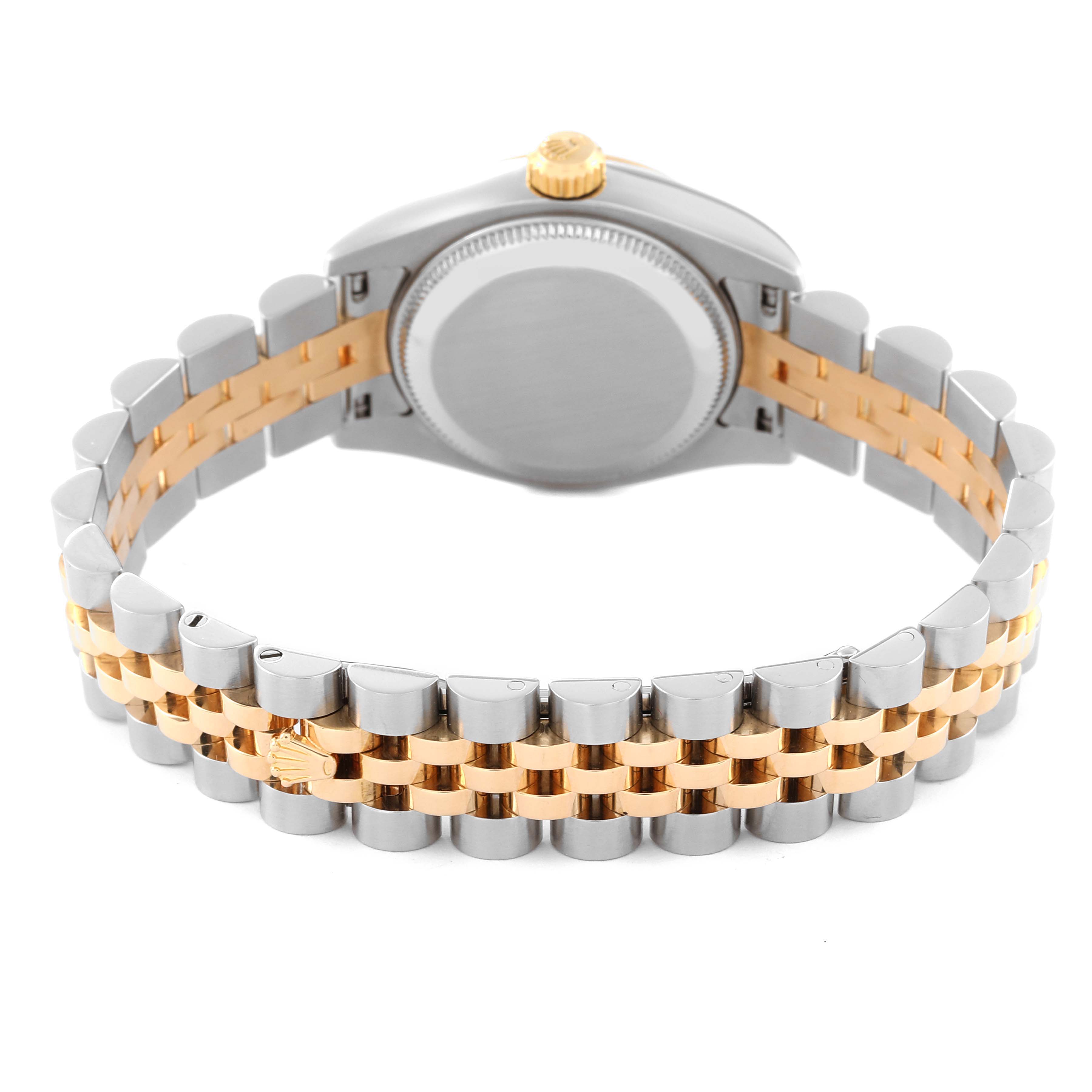 The image shows the backside of the case and the bracelet of a Rolex Datejust 179173 Women's Steel and Gold (two tone) Champagne Dial 179173 Women's Steel and Gold (two tone) Champagne Dial watch, highlighting the two-tone metal links and crown.