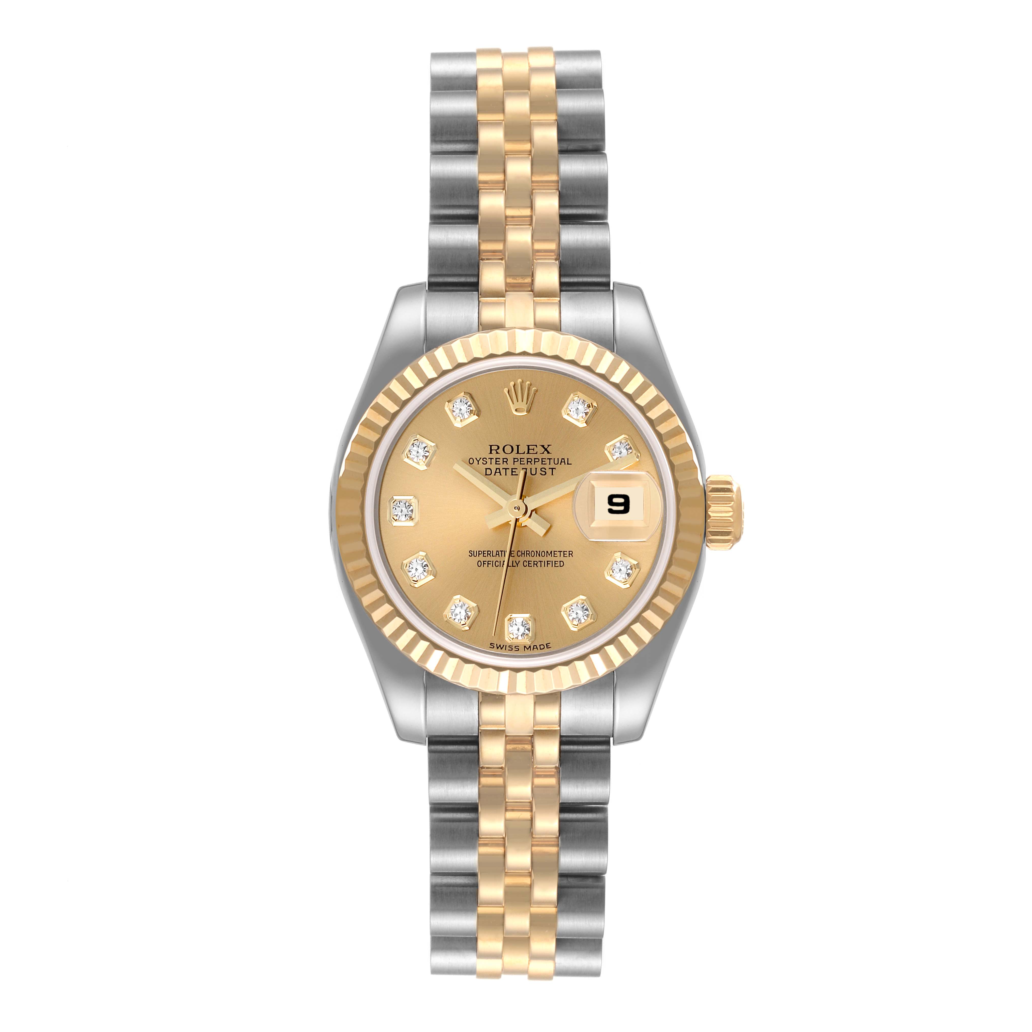 The Rolex Datejust 179173 Women's Steel and Gold (two tone) Champagne Dial 179173 Women's Steel and Gold (two tone) Champagne Dial watch is shown from a top-down angle, displaying its gold and silver bracelet, fluted bezel, and date window.